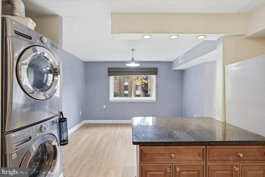 Central to MD, DC, VA, and Baltimore.  The in-unit washer has occasional cycle irregularities, and a $2,000 credit is being offered to the buyer toward flooring and washer. This roomy 1-bedroom, 1-bath condo delivers easy living, everyday comfort, and a location that works for your lifestyle. The kitchen is nicely updated with granite counters, stainless appliances, and plenty of cabinet storage. Natural light flows into the open living area, and the private patio gives you space to unwind or host a few friends. The bedroom provides generous storage, and having your own washer/dryer in-unit makes daily living simple. The condo fee covers electric, gas, water, parking, and community amenities, so budgeting stays predictable and maintenance stays low.  Ideal for first-time buyers, downsizers, or investors searching for an affordable option in a commuter-friendly location.