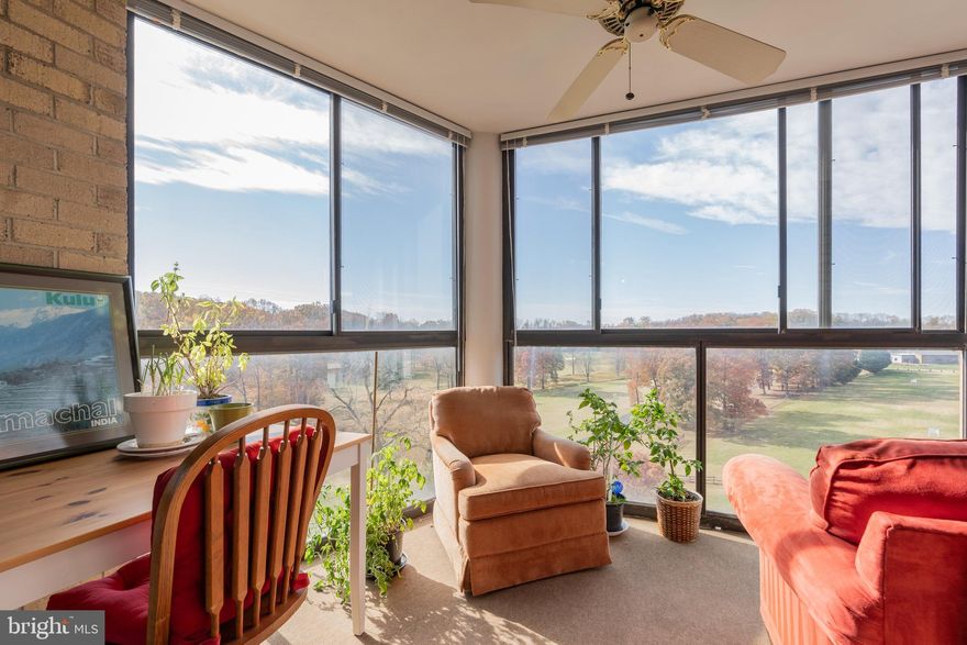 NEW PRICE---Rarely available 2-bedroom, 2-bath end-unit with unbeatable panoramic golf course views in Leisure World’s sought-after 55+ gated community. This light-filled home features luxury vinyl plank flooring and an updated kitchen with granite counters, modern cabinetry, stainless steel appliances, and a new dishwasher, microwave, and washer/dryer. You’ll love the spacious walk-in pantry and the bright window overlooking nature. Both bedrooms are generously sized and offer private ensuites. The second bedroom includes a glass-enclosed walk-in shower with stylish tilework, an updated vanity, and direct access to the impressive sunroom. The owner’s suite boasts an updated bathroom, vanity area, and abundant closet space. The showstopper is the expansive floor-to-ceiling windowed sunroom, delivering jaw-dropping, one-of-a-kind views of the golf course and surrounding landscape. Additional highlights include a separate dining room, a large family room, and the privacy and natural light that only an end-unit provides. Premium perks include a coveted garage parking space (#152) located right outside the elevator, plus a private storage room (#23), a notable upgrade over standard caged storage. Leisure World residents enjoy resort-style amenities including clubhouses, restaurants, indoor and outdoor pools, tennis and pickleball courts, an 18-hole golf course, fitness center, MedStar Health Center, walking paths, and endless clubs and activities. Condo fee covers basic cable, water/sewer, building maintenance, and many community amenities. Prime location with easy access to the ICC and I-270, plus a nearby commuter bus lot.  Move in and embrace the Leisure World lifestyle!