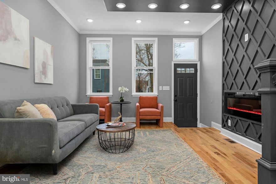 Welcome to 1908 E Lanvale – a contemporary, state-of-the-art renovation in a thriving neighborhood. Designed with impeccable attention to detail, this home seamlessly blends luxury and functionality. Enter the main level to find an airy, open floor plan with custom tray ceilings, a sleek modern fireplace, and exquisite hardwood floors. The gourmet kitchen serves as the heart of the space, featuring Shaker cabinetry,  stone countertops and stainless appliances. 

The upper level hosts three  bedrooms with large closets and spa-inspired bathrooms, creating a serene retreat. The fully finished, walk-out lower level includes a private guest area with its own full bathroom, and a den perfect for remote work or extra living space. Outdoors, a fenced backyard offers privacy and is ideal for entertaining. This home also boasts a new HVAC system, all-new electrical, plumbing, framing, and roofing—every component thoughtfully upgraded. Experience modern city living at its finest. Come, see, and make 1908 E Lanvale your new home