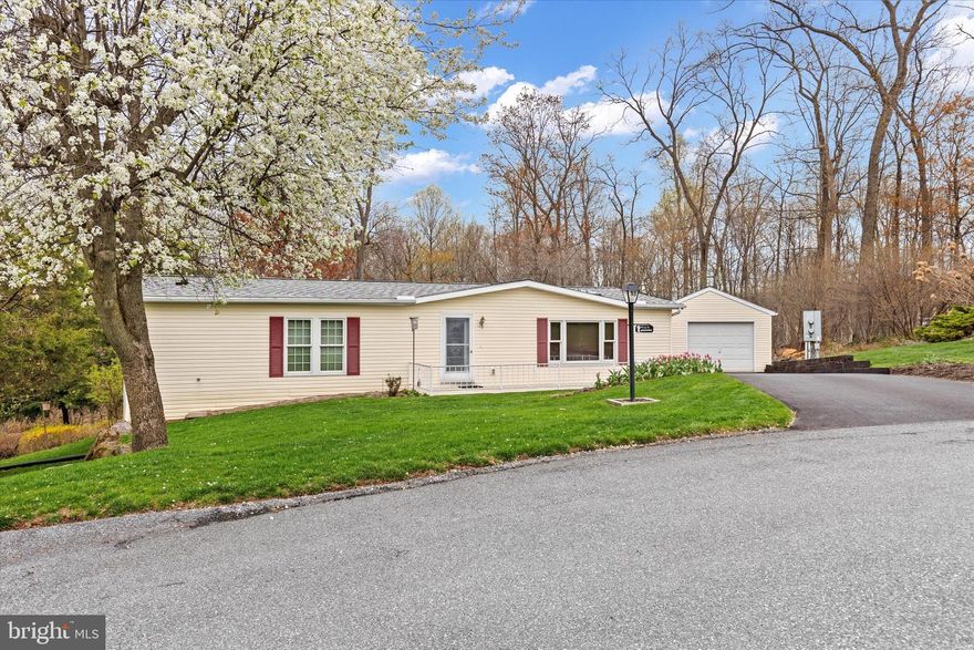 Welcome to 38 Aspen Drive, Manheim, PA! 
Nestled at the end of a quiet cul-de-sac in the desirable 55+ community of Gretna Springs, this well-maintained home radiates pride of ownership from the moment you arrive.
Offered by the original owners, this home features 2 spacious bedrooms and 2 full bathrooms and offers comfortable, one-floor living. The primary suite measures an impressive 16'9" x 12' and includes a private bathroom and ample closet space.
The living and dining rooms flow seamlessly into the kitchen, creating an inviting space for both everyday living and entertaining. The dining room features a sliding glass door that opens to a large, partially covered back deck, perfect for relaxing and enjoying the peaceful, partially wooded backyard.

The home is filled with natural light, thanks to three skylights that add warmth and brightness throughout the living spaces.

Just down the hall, you’ll find a convenient laundry room with an additional exit to the deck.

The sellers took extra care when building this home, choosing thoughtful upgrades like additional insulation and high-quality subflooring. Additional highlights include a detached garage and a low-maintenance lifestyle in a quiet, welcoming neighborhood.
💰 Lot rent is $410/month and includes:
Water
Sewer
Trash & Recyclables
Access to the Community Clubhouse
RV Parking (when available)
This lovingly cared-for home is move-in ready and waiting for you to make it your own!