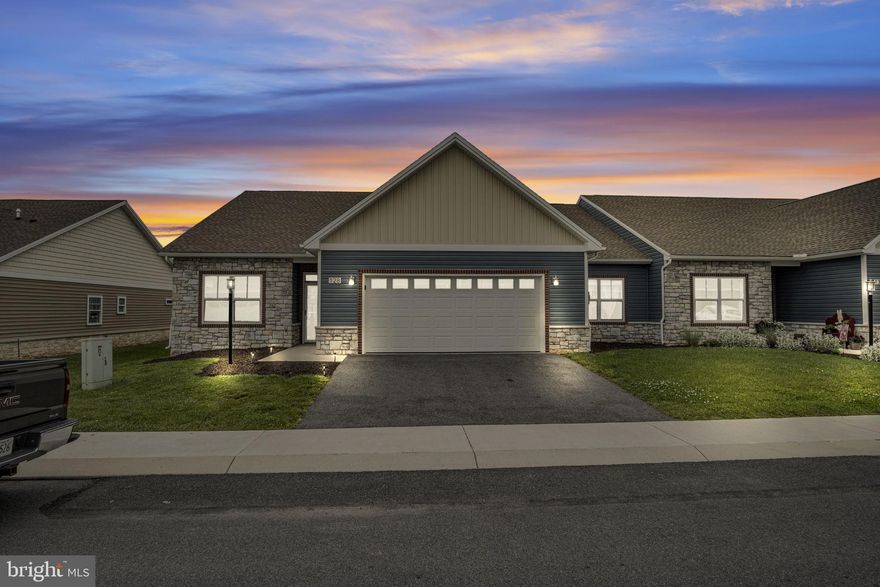 Beautiful end-unit single-floor townhouse in the desirable MeadowsGreen community. This open floor plan features LVP flooring in the main living areas, carpeted bedrooms, and ceramic tile baths. The kitchen offers craftsman-style soft-close cabinets, quartz countertops, and a walk-in pantry with sliding track door.

The great room showcases a floor-to-ceiling stone fireplace with natural gas insert, custom mantel, and cathedral ceilings. The spacious primary suite features a tray ceiling, dual walk-in closets, and a private bath with dual vanities, 5’ fiberglass shower, and separate toilet room.

Exterior features include vinyl siding with stone and brick accents for added curb appeal. Quality finishes and easy one-floor living make this home a must-see.