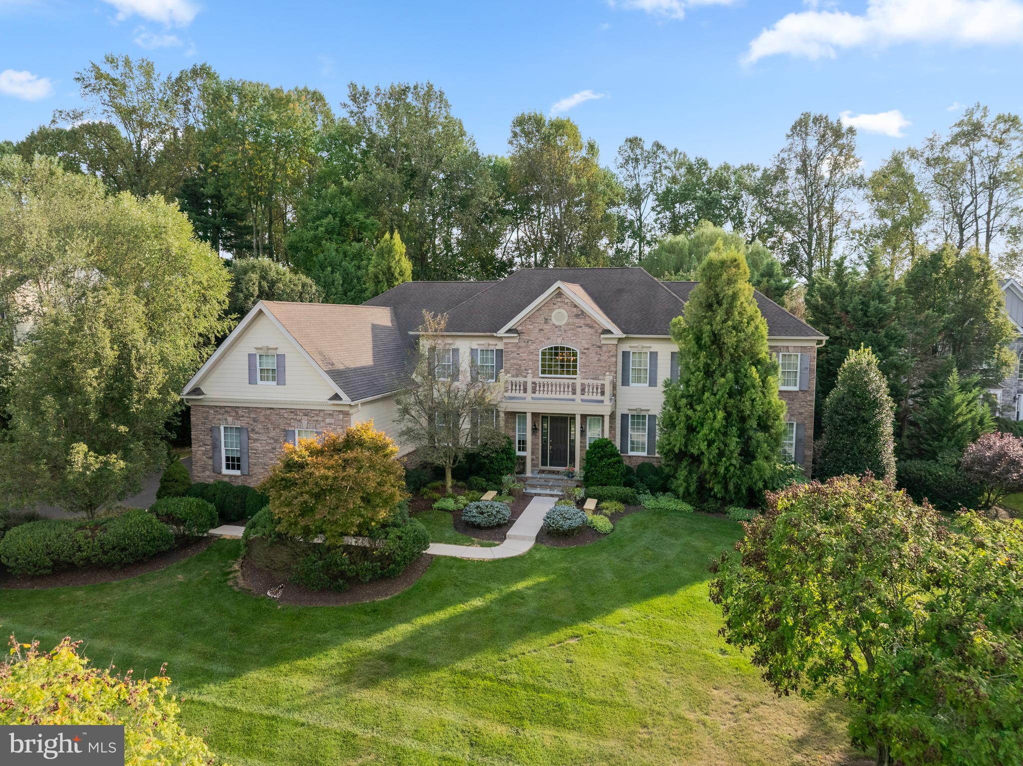 Every once in a while, a one-of-a-kind property comes to the market and that time is now! 17 Poplar Rd is a custom home featuring a combination of valued features you will not find anywhere else. It sits proudly on a premium lot in sought after Estates at Chadds Ford. Built in 2007, no expense was spared and no detail was overlooked in the careful planning, and it shows. As you approach the home, you will immediately notice the handsome exterior including mature landscaping, extensive hardscaping, and distinctive lighting. Take note of the recent capital improvements including Hardie siding and replacement windows. A welcoming portico front entry welcomes you into the home. A brilliant floor plan awaits inside that perfectly blends traditional design with every accommodation for today’s lifestyle. Prepare to be wowed by the dramatic 2-story foyer with double curved staircase and crystal chandelier. The main level was supersized with structural options galore, including family room and kitchen bump outs plus the massive conservatory. You will also find 10’ ceilings, convenient rear staircase, gorgeous hardwoods, custom paint, extensive millwork, high-end fixtures, abundance of recessed lights, built-in speakers, 2 powder rooms, 2 gas fireplaces, and separate laundry room. The main level is highlighted by the kitchen, breakfast room, and family room. The dream kitchen was designed for a chef. It features upgraded cabinetry with glass and light accents, granite counters, tile backsplash, huge island, GE monogram stainless appliances, double oven, 5-burner cooktop, wine fridge, prep sink, and walk-in pantry! The kitchen opens to the breakfast and family rooms. The bright breakfast room has triple doors that lead to the patio. The cozy family room features a floor-to-ceiling stone fireplace and 4 windows to enjoy views of the backyard oasis. The upper level is highlighted by the primary bedroom suite. It’s a huge airy room with a sitting area and walk-in closet with organizers. The primary bathroom feels like an at-home spa with tray ceiling, oversized jacuzzi tub, walk-in shower with dual heads and bench, 2 separate extended vanities, and 2 separate water closets. Through the bath are 2 additional walk-in closets. There is no shortage of storage! This level is completed by 3 additional generously sized bedrooms all with en-suite bathrooms, and a loft/5th bedroom. Need more space? The finished lower level is perfect for a home gym. There is also a huge custom wine room with dedicated climate controls! Looking for outdoor living space? Step outside to experience staycation redefined! It is truly a vacation at home with saltwater pool with expanded decking, hot tub, lower patio, upper patio with fire pit, and usable flat yard space. Need more value? There is a 4-car garage, newer whole house Generac generator, replaced HVAC systems, 3 zones for efficiency, central vacuum, laundry shoot, and walk-up basement. It also has the trifecta – public water, public sewer, and natural gas! All of this in the most convenient Chadds Ford location. You must see it in person to fully appreciate the incredible value this special property offers. Schedule your tour today!
