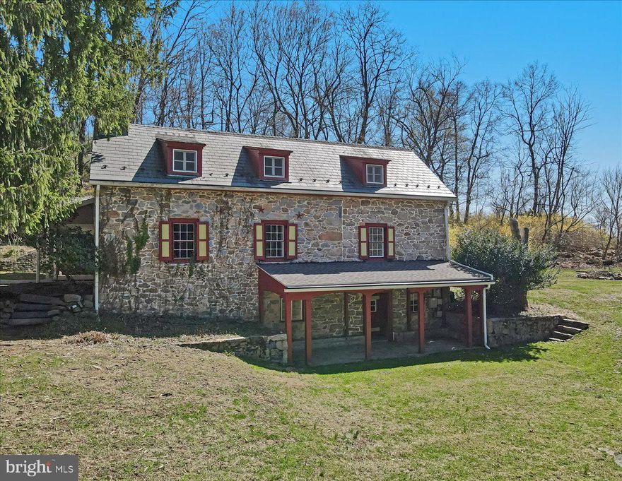 Nestled in the heart of Exeter Township, 2 Wyndham Hill Dr is a historic gem that seamlessly blends 19th century charm w/ modern comforts. Built in 1827, this distinguished stone farmhouse spans over 3,600 sq. ft. and is set on an expansive 3.49 Acre lot, offering both privacy and picturesque surroundings. The exterior boasts a private pond, mature landscaping, stone summer kitchen, an oversized detached garage, 2 story framed barn, and a carport for additional covered parking. The residence offers 4-5 generously sized bedrooms and 3.5 baths, providing ample space for family and guests. The main floor offers a large eat-in kitchen, family room, formal living room w/ fireplace, family room, 20x18 sunroom w/ spiral staircase, full bath, and an office/den. Upstairs you will find a spacious master suite w/ a private bathroom, walk-in closet, and access to a private deck/walkway, 3 additional bedrooms, full bath, and laundry room. The expansive grounds offer endless possibilities and conveniently located close to schools, shopping, and highways. Schedule your showing today!