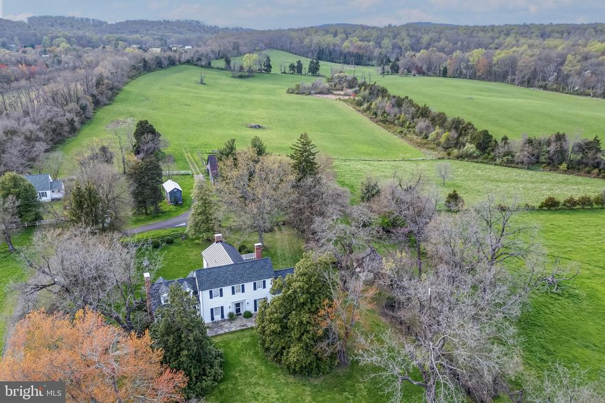Unique offering in Fauquier County with many opportunities for ecotourism, agritourism,  productive agriculture, conservation programs, and easement tax credits.  Evergreen Hollow is comprised of nearly 162 acres of verdant and serene Virginia countryside with an abundance of wildlife, lush green fields, and wooded trails. The historic Evergreen 1859 farmhouse was once referred to as the Virginia "White House" and was home to the Hunton family from 1745 to 1809, Huntons were a founding family of Fauquier County.  The 6-bedroom home is steeped in history and elegance and would suit as an ideal bed & breakfast, restaurant or wedding/tourism accommodation. There are 2 scenic viewsheds on the back fields and 3 ponds that would be ideal locations for a primary residence or entertaining venue.  Of special interest are the summer kitchen and original square stone smokehouse off the kitchen patio.  Several outbuildings include a detached garage, original farm granary and barn, and a three-bedroom, one-bath cottage, ideal for income or a farm manager   The farm fields provide prime grazing and hay for horses or livestock and there is a 50-acre woodlands teeming with wildlife at the back of the property.  The land is currently farmed and has good soils with a history of vines planted by the farmhouse.  Evergreen Hollow, provides a respite, though located in easy distance from the historic Buckland village, Warrenton, Gainesville, 30 minutes to Dulles international airport, and less than an hour drive from the nation's capital.  Excellent opportunity for land conservation programs in conjunction with tourism such as a winery & tasting room, wedding & event venue, microbrewery & distillery, and farm stay & market to name a few.  The Farm has not been offered for over 7 decades and is truly a special piece of Virginia history!