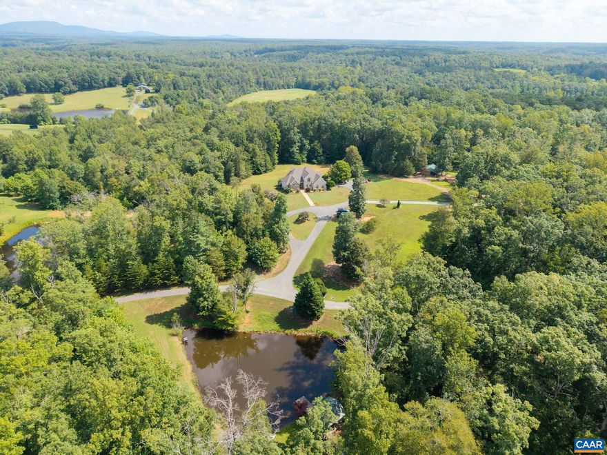 A hidden gem within the scenic Keswick area!  Only 10 minutes to Charlottesville and a couple minutes to I64 makes this location ideal!  With over 33 acres, multiple ponds, a main house and a 2000 square foot cabin, the possibilities of this property are endless! There is even a portion of the land that has been used for weddings in the past! Bring your ATV!  This property is the Outdoorsman's dream as it offers plenty of room for hunting and fishing!  Turn it into your own personal retreat! Plenty of room for extended family or guest! The main house is custom built and holds a bit of history as the woodwork is from James Madison's Montpelier.  You will find high craftsmanship through-out, including the Italian tile on the back porch. Make your appointment and come claim it for yourself!,Cherry Cabinets,Granite Counter,Fireplace in Living Room