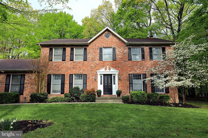 Beautiful Brick Front Colonial in the Best Location too! It boasts a completely "New 2020 Gourmet Kitchen" with Quartz Counters, Stainless Appliances, Island w/ electric, Upgraded Cabinets with Floor to Ceiling Storage Options, Several Specialty Drawers, and Beautiful New Flooring and Lights, all with state of the art dimmers and LED.  The First floor is spacious and perfect for entertaining. It features a Bright Eat-in Kitchen, open to the Family Room with French Doors to Deck and Brick Fireplace with Mantel and Wood Stove Insert.  The Elegant Formal Dining Room is just around the corner also with Fresh Paint, Chandelier and Custom Wine Rack. You may choose to slip away to the Library with Custom Built-In Bookcases and enjoy a book or double the use as a Separate Office.  First Floor has hardwood throughout and painted in 2020.  Plantation Shutters and all Window Treatments Convey. Formal Dining and Library have custom blinds that can operate top to bottom, or bottom to top depending on how much natural light you prefer at the moment.  Half Bath with Granite, Custom Sink, and separate Laundry Room are also on first floor. Four Beds and two full baths upstairs. Master Suite has Two Large Walk-In Closets (one has Built-Ins), Room Darkening Shades with Remote, New Ceiling Fan, Wood Accent Wall, Fresh Paint, and Separate Dressing Area. The Updated Master Bath has Large Soaking Tub, Double Sink Vanity, Fresh Paint, new Lights, Mirrors and separate Linen Closet.  All bedrooms have good size closets. Home is very energy efficient! It has Dual Zone Systems, added extra attic insulation and attic fan.  For the Car Enthusiast or Hobbyist the home has an Attached 2 car Garage and Second Detached 2+ Car Garage and 3 Storage Sheds! Detached Garage has AC/Heat, attic storage w/ pull down stairs, and 220 power! This home is a "Perfect Location" for commutes to DC, National Harbor, Andrews, Pax and Indian Head Bases.  Enjoy the peaceful, quiet setting on 2 acres, listen to the morning birds while enjoying coffee on the deck, or set up your grill for dinner.  Nature abounds in this private setting, yet tucked in a beautiful neighborhood. There is NO HOA, NO La Plata Town Tax, yet only two miles to Shopping and Dining! Home is turn key and ready for its next owners to enjoy.  Schedule your showing today.