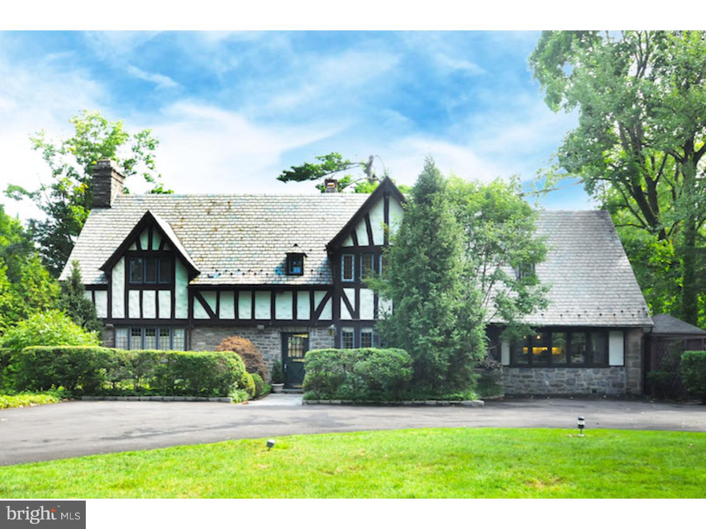 RARELY does a home so lovely in both presentation and location become available in desirable Rydal! Dramatic circular driveway leads to an exquisitely appointed 1930s classic English Tudor crafted with steep slate roof lines, dormered windows, hand-troweled stucco and Wissahickon schist. Impressively set back on a professionally landscaped 1 acre lot with curb appeal to make any owner feel proud. Meticulously modernized, this once estate 'carriage home' has been architecturally modified with many crown jewels including a 'show-stopping' kitchen, great room and den.  Follow the front yard garden pathway through the 'statement-making' front door to over 4,000 sf of original design details like leaded glass windows, wood floors and treasured Mercer tiles. Philadelphia icon in kitchen design, Joanne Hudson, and lighting architect, Ray Grenald, were integral in modifying the space and character of this special home. Large center hall sets the stage for a classic Colonial layout with dining room to the right and living room to the left.  Custom millwork, built-ins & closets have been incorporated throughout. The gourmet kitchen/great room was 'blown out' in 2000 to open the space for great cooking and entertaining.  Large kitchen island is surrounded by inset custom cabinets, high-end appliances, Sub-Zero fridge, quartz counters & Pella windows.  Complemented by a breakfast area, gardener sink and rear stairwell makes this room the 'heart' of the house.  The dining room flows off the kitchen divided by raised paneled pocket doors. The elegant living room with original hand-carved fireplace mantle, impeccable millwork and lighting leads to a family room addition. Addition design elements include original exterior stone wall, reclaimed wood beams, custom shelves and a wall of windows with slider to the composite deck and side-yard pool; private and reminiscent of a 5-star retreat. The center staircase leads directly to the upstairs office with vaulted ceiling and custom shelving. Master bedroom suite is customized with built-ins, walk-in closet and master bath with soaking tub & frameless shower. Two large upstairs bedrooms (one currently used as a second office) share a hall bath with double sinks and large shower. Fourth bedroom off the rear stairwell has a private, full bath. Second floor laundry. Zoned Heat/AC. Fenced-in side yard. In-ground sprinkler system.  Minutes to Rydal train station, Whole Foods Market & local hospitals. A must see property!