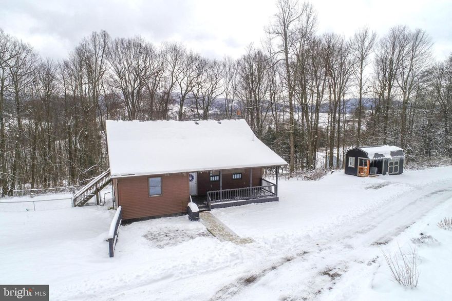 Set in a peaceful wooded setting, this 3 bedroom, 3 bath retreat perfectly blends rustic charm with modern convenience. The open concept floor plan seamlessly connects the kitchen and family room, creating an ideal space for entertaining or everyday living. The spacious basement offers additional living space and includes a versatile bonus room that is perfect for a home office, gym, guest area, or recreation room.
Step outside to enjoy a large deck ideal for relaxing and taking in the surrounding nature. An oversized detached garage and an additional shed provide ample space for vehicles, equipment, or hobbies. The home is hard wired for high speed internet, making it well suited for remote work or streaming. Updated throughout with a roof just 2 years old, this move in ready property offers flexibility as either a cozy vacation getaway or a full time residence. Situated on 1.80 acres and sold with an adjoining 3.01 acre lot, the property totals nearly 5 acres of serene mountain living with future potential. Located just minutes from Deep Creek Lake, Wisp Resort, and local amenities, it offers the perfect combination of privacy, tranquility, and convenience in a scenic wooded setting.