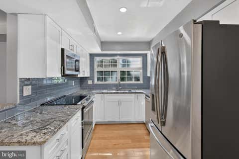 Photo of 7742 New Providence Drive #108, FALLS CHURCH, VA 22042 (MLS # VAFX2326450)