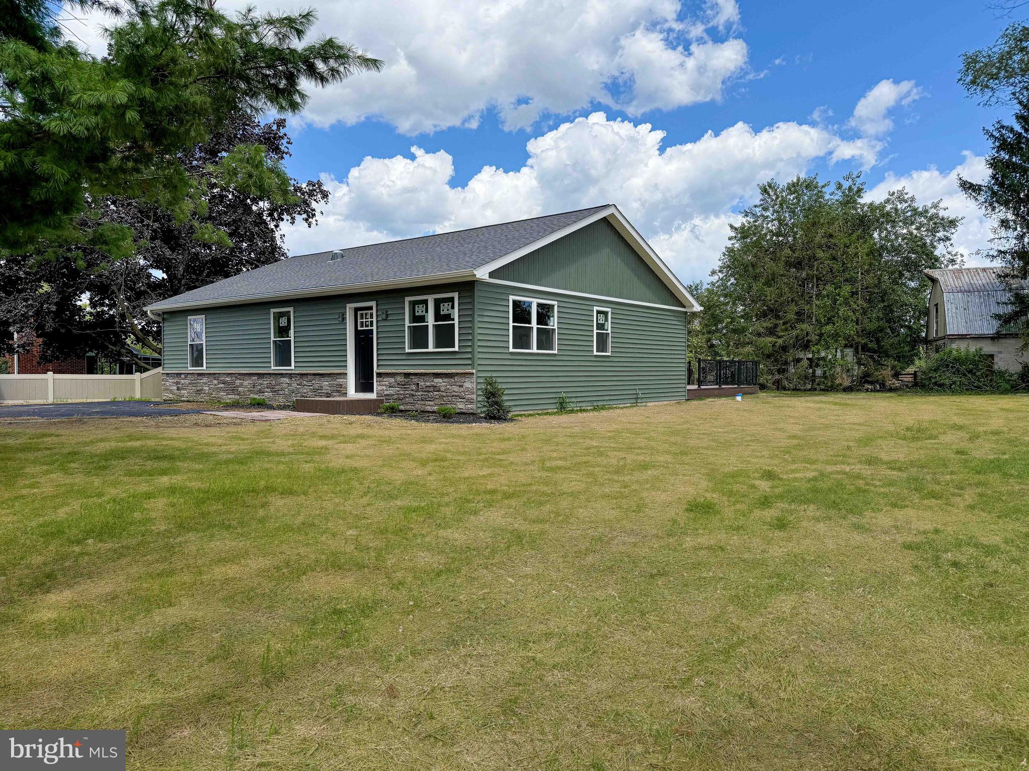 Charming Brand New 3-Bedroom Home in a Rural Setting!
Welcome to your dream home! This brand-new build, 3-bedroom, 1.5-bath residence, located on a peaceful back road, offers the perfect blend of modern comfort and serene country living. Enjoy the privacy and quietude of this tranquil rural setting while remaining conveniently close to essential amenities.
The home features spacious living areas with an open and airy layout, ideal for both relaxing and entertaining. The living room, highlighted by a cozy fireplace, creates a warm and inviting atmosphere, perfect for chilly evenings. Large windows allow ample natural light to brighten the space. The well-equipped kitchen is designed with functionality in mind,, plenty of counter space, and ample cabinetry, perfect for preparing meals and gathering with family.
Each of the three bedrooms provides generous closet space. The stylish bathrooms include a full bathroom with contemporary fixtures and finishes, while the convenient half bath adds extra comfort for guests and family members.
Step outside to enjoy a large, grassy yard and beautiful natural surroundings, or unwind on the relaxing back deck, ideal for outdoor dining or simply taking in the peaceful views. The property’s quiet back road location ensures minimal traffic and a serene atmosphere, allowing you to fully embrace the tranquility of rural living.
Despite its peaceful setting, this home is just a short drive from local shops, schools, and recreational facilities. Don’t miss the opportunity to own this delightful brand-new home in a serene rural setting. Contact us today to schedule a viewing and experience the charm and comfort this property has to offer!