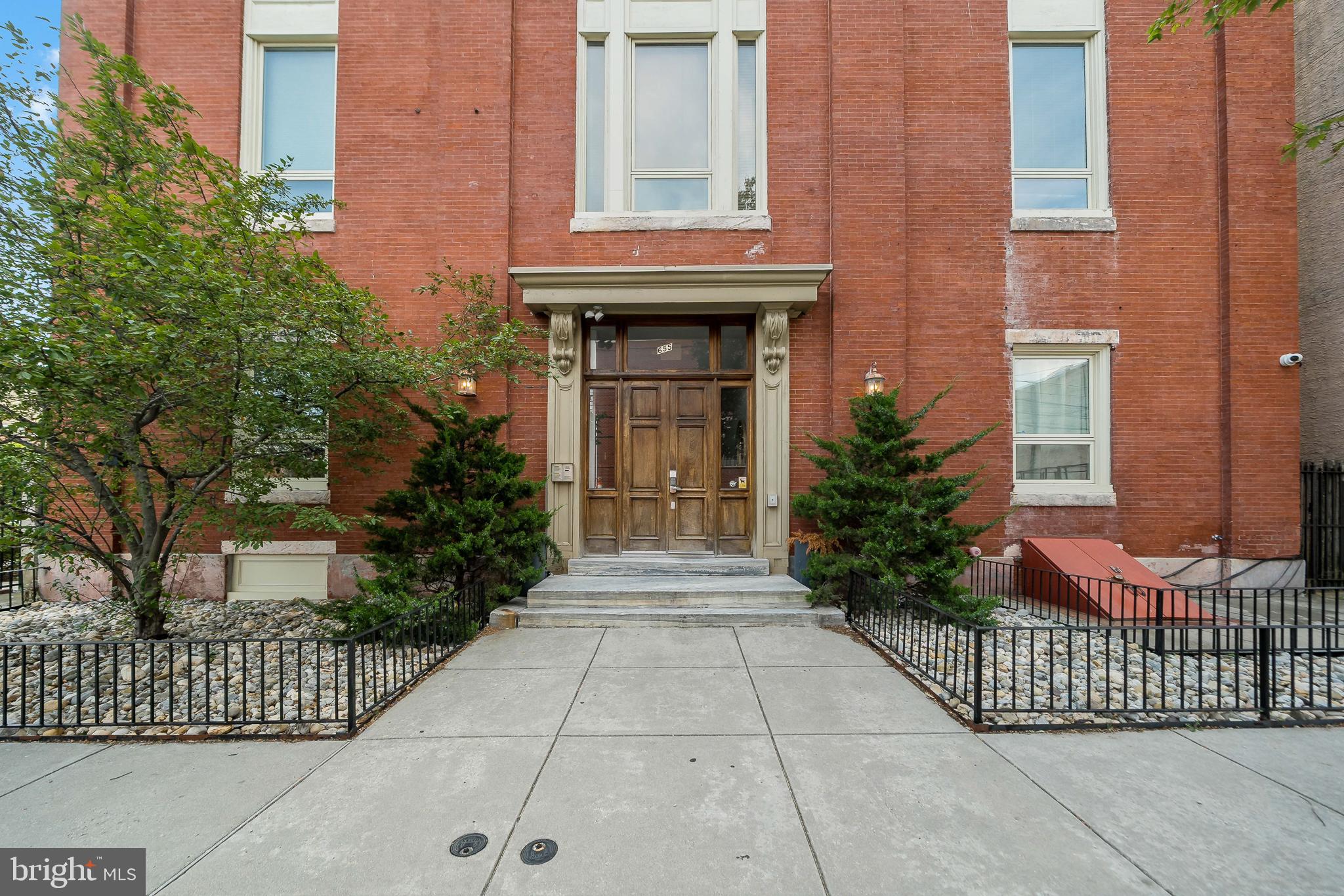 Discover this remarkable two-bedroom, one-bath condo, located in the heart of the highly sought-after Fairmount area. As soon as you step inside this first-floor gem, you’ll be impressed by the expansive open-concept design, perfect for both everyday living and entertaining. The home’s soaring 11-foot ceilings and oversized 8-foot windows flood the space with natural light, creating an airy, inviting atmosphere.
The kitchen is truly the centerpiece of this home, designed for the modern urban chef. It features granite countertops, stainless steel appliances, and a large island with bar seating, perfect for casual dining or meal prep. A spacious walk-in pantry adds ample storage for all your culinary needs. Just off the living room, you’ll find your own private outdoor space, ideal for al fresco dining, morning coffee, or evening barbecues.
The primary bedroom is a sanctuary of comfort, boasting a large window that brings in additional natural light, plus two generously sized closets – including an expansive walk-in closet that offers plenty of space for your wardrobe and storage needs. The second bedroom is flexible and can easily be used as a guest room, home office, or workout space, making it perfect for a variety of lifestyles.
At the end of the hall, you’ll find the sleek and well-maintained bathroom, alongside a conveniently located laundry room and mechanical room. Additionally, this unit includes access to extra storage in the building’s basement, providing even more space for your belongings.
Calvary Condominiums offers the ultimate in convenience and urban living. You’ll be just steps away from public transportation, with easy access to major highways, making commuting a breeze. The building is also within walking distance of Center City, Whole Foods, Aldi, and a wide variety of restaurants, shops, and entertainment options on Fairmount Avenue, Broad Street, and neighboring areas. Whether you're looking to explore the best of Philadelphia or enjoy the comfort of your new home, Unit 2 has it all.
