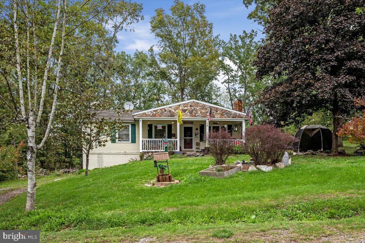 Don’t miss out on this fantastic opportunity on this Three Bedroom, two bathroom ranch style home sitting on over ½ an acre lot conveniently located minutes from the Virginia/West Virginia line and only 30 minutes to Winchester. Large modern kitchen with plenty of cabinets. Living room with hardwood floors. Dining area. Enormous front porch with plenty of area for relaxing. Deck overlooking the large rear yard with storage building. The walkout basement offers a family room with old barn board paneling and woodstove, bonus room, bedroom, and full bathroom. Two driveways so you won’t run out of parking.