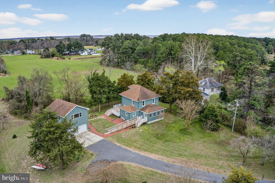 Timeless character meets thoughtful upgrades on over an acre in a quiet, secluded setting near the water.
This 3 bedroom, 2 bathroom home has been carefully maintained to preserve its original charm, including original hardwood floors, while incorporating meaningful improvements such as a newer roof, updated HVAC, and a tankless water heater.
The oversized detached garage with a heated bonus room above offers endless flexibility, whether for a private office, guest space, or hobby area.
Located just moments from nearby water access, this property delivers a balance of privacy, functionality, and Eastern Shore lifestyle.