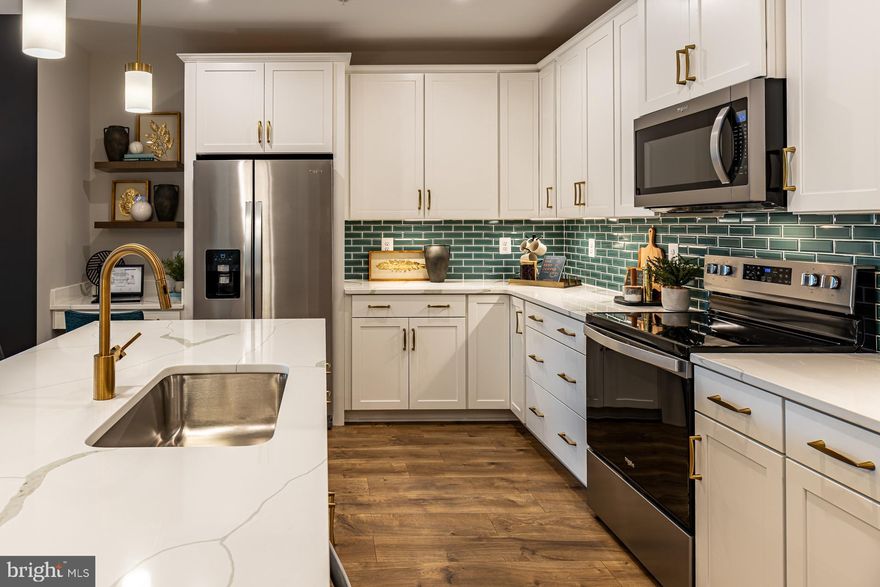 Find Your Perfect Fit at Gatherings at Cabin Branch. Whether you're looking to elevate, downsize, or rightsize your lifestyle, this 55+ community in Clarksburg offers the perfect balance of comfort and convenience. Choose from five stylish condo floorplans with elevator access and enjoy amenities like a billiards room, gym, golf simulator, and more. Join community events at the clubhouse or explore Clarksburg Outlets for shopping and dining. At Gatherings at Cabin Branch, you’ll be close to everything that matters most—daily conveniences, top-tier amenities, and cherished connections. Move-In Ready!!! Enjoy over 1,500 sq. ft. of living space, including a spacious kitchen featuring a walk-in pantry and breakfast bar. The living room and dining area provide plenty of space for entertaining and grant access to each bedrooms, as well as the private balcony. The sizeable secondary bedroom offers a walk-in closet, where as the primary suite provides two closets and a spa-inspired bath with an oversized shower and seat! Included features: Elevator Access, 1-car garage, laundry package (washer and dryer), spacious kitchen island with center sink, designer hardwood flooring in select rooms, dual vanities in the primary bath. This home is rated Energy Series PLUS, meaning you receive enhanced construction features that deliver a tighter, more efficient home. In addition to being ENERGY STAR certified and Indoor airPLUS qualified, this home has higher performing low-e windows, HVAC equipment and ductwork in conditioned space, and more – saving you tons of money each month on utilities! ** Photos of the model home. *Pricing, features and, availability subject to change without notice. MHBR No. 93  2023 Beazer Homes.