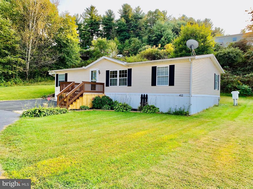 Completely remodeled, ultra modern, open concept design 28X48 double wide at the end of a cul-de-sac. Enjoy scenic views on your jumbo corner lot by the woods. Open floor plan perfect for entertaining. Large eat in kitchen. All brand new, top of the line stainless steel appliances come with the sale. Nicely sized bedrooms with big soak tub and stand up shower in master suite. Open floor plan kitchen and family room perfect for large sectionals, big TVs and entertaining.  Enjoy the views of the woods from your big side deck and yard.