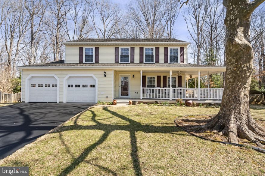 A MUST SEE in Woodbridge!! Welcome to 4870 Tobacco Way in the family-friendly community of Colony Woods.  Three finished levels with loads of updates throughout! NO HOA! Huge, HALF ACRE lot!! This immaculate 4 bedroom with 2 full baths and 2 half baths, nestled on a quiet street with no through traffic, offers plenty of space for living both inside and outside. When you arrive, you are welcomed by a manicured lawn and an inviting wrap around front porch with plenty of room for rockers and porch swing. As you enter this move-in ready home, you are greeted by a light-filled formal living room with adjoining dining room. The spacious kitchen has newer appliances with Formica solid surface countertops, generous cabinet space and a pantry.  Enjoy morning coffee or everyday meals in the eat-in kitchen that flows into a large family room with built-in shelving and wood burning fireplace. The family room opens to an adjoining sunroom/three season room that overlooks the large backyard and connecting deck, seamlessly blending indoor and outdoor dining, entertaining, and simple relaxation. The upper level hosts 4 well-appointed bedrooms, including the primary suite with large closet and ensuite bathroom with dual vanities. Down the hall, three additional large bedrooms, each with generous closet space, have easy access to the hall bath with tub/shower combo. Double hung Low-E windows provide energy efficiency throughout the home. A finished basement has endless possibilities with large recreation room, half bath, bonus room, washer/dryer, and plenty of storage space. There's an additional laundry room on the main level for added convenience. Enjoy crisp fall evenings on your front porch or rear deck overlooking fully fenced backyard surrounded by mature trees for added privacy with plenty of room to play or entertain. Large storage shed (160 sq ft) with electricity is perfect for hobbyists or storage. Attached 2-car garage with room for extra storage.  Ideally situated close to shopping, restaurants, and commuter lots.