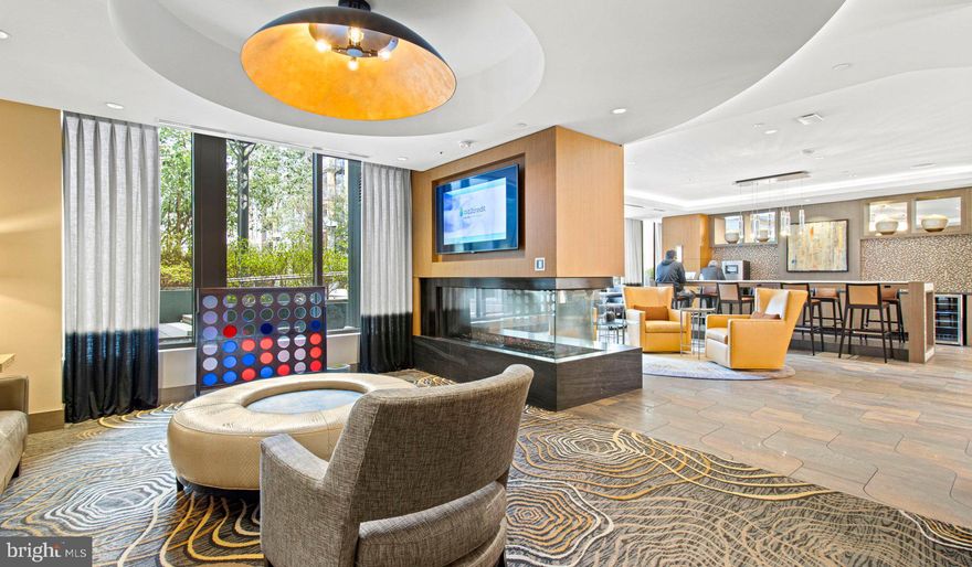 Nestled in the vibrant heart of Bethesda, Maryland, this luxury apartment complex offers an unparalleled living experience that combines modern convenience with sophisticated design. Designed to cater to the discerning tastes of urban dwellers, this property stands as a testament to luxury living, where every detail has been meticulously crafted to ensure the utmost in comfort and style.
*Exceptional Location*
Located in the sought-after Woodmont district, the apartment complex is perfectly positioned as a gateway to the best that Bethesda has to offer. Residents enjoy easy access to a plethora of amenities, including the Walter Reed National Military Medical Center, the NIH, and a variety of shopping, dining, and entertainment options. The prime location also offers convenient access to public transportation, making it easy to explore the wider metropolitan area.
*Architectural Elegance and Design*
The building's U-shaped design opens up to a beautifully landscaped courtyard, offering a seamless transition from the bustling city life to a tranquil oasis. The architecture is both richly textured and humanly scaled, creating an inviting streetscape that residents are proud to call home. A dramatic window wall façade and ground-level duplex units with front porches and planters further enhance the building's aesthetic appeal.
*Luxurious Amenities*
Residents of this apartment complex enjoy access to an array of exceptional amenities designed to enhance their lifestyle. The property boasts a large fitness center, fireside lounges, and a rooftop lounge equipped with bars, fireplaces, grilling areas, and two pools. Additionally, the convenience of having a 50,000 square foot grocery store within the building cannot be overstated. The property is also LEED Gold Certified, reflecting a commitment to environmental sustainability.
*Sophisticated Living Spaces*
The apartments themselves are a reflection of the luxury and sophistication that define the property. With a variety of floor plans, including studios, one to three-bedroom apartments, and townhomes, there is something to suit every preference. Each unit features designer finishes, stainless steel appliances, and spacious layouts that make coming home a pleasure.
*Community and Convenience*
The property is known for its friendly and helpful staff, ensuring that the needs of residents are met with professionalism and care. The well-maintained common areas and the sense of community fostered among residents make this complex more than just a place to live—it's a place to belong.
This luxury apartment complex in Bethesda, Maryland, offers an unmatched living experience for those seeking the best in urban living. With its prime location, architectural elegance, luxurious amenities, and sophisticated living spaces, it stands as a beacon of modern luxury and convenience. Realtors and renters looking for a property that combines the vibrancy of city life with the comfort of upscale living will find everything they desire and more at this premier apartment complex.
** Pricing and availability subject to change on a daily basis ** Photos are of model units ** Parking may be available for additional fee **