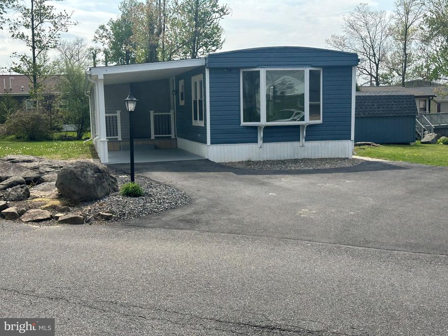Don't miss   completely remodeled home. A 3rd bedroom has been added ,there is drywall throughout, new windows, new kitchen cabinets, granite countertops,and a new smooth top stove. There are also new carpets and flooring throughout. There is double insulation to make a very energy efficient home. Included in the monthly land lease fee of $ 991 and $25 water fee is the pool, mini golf, chip and putt, fishing ponds and the use of the community hall for private functions, there is also a hiking/biking trail. Park approval required