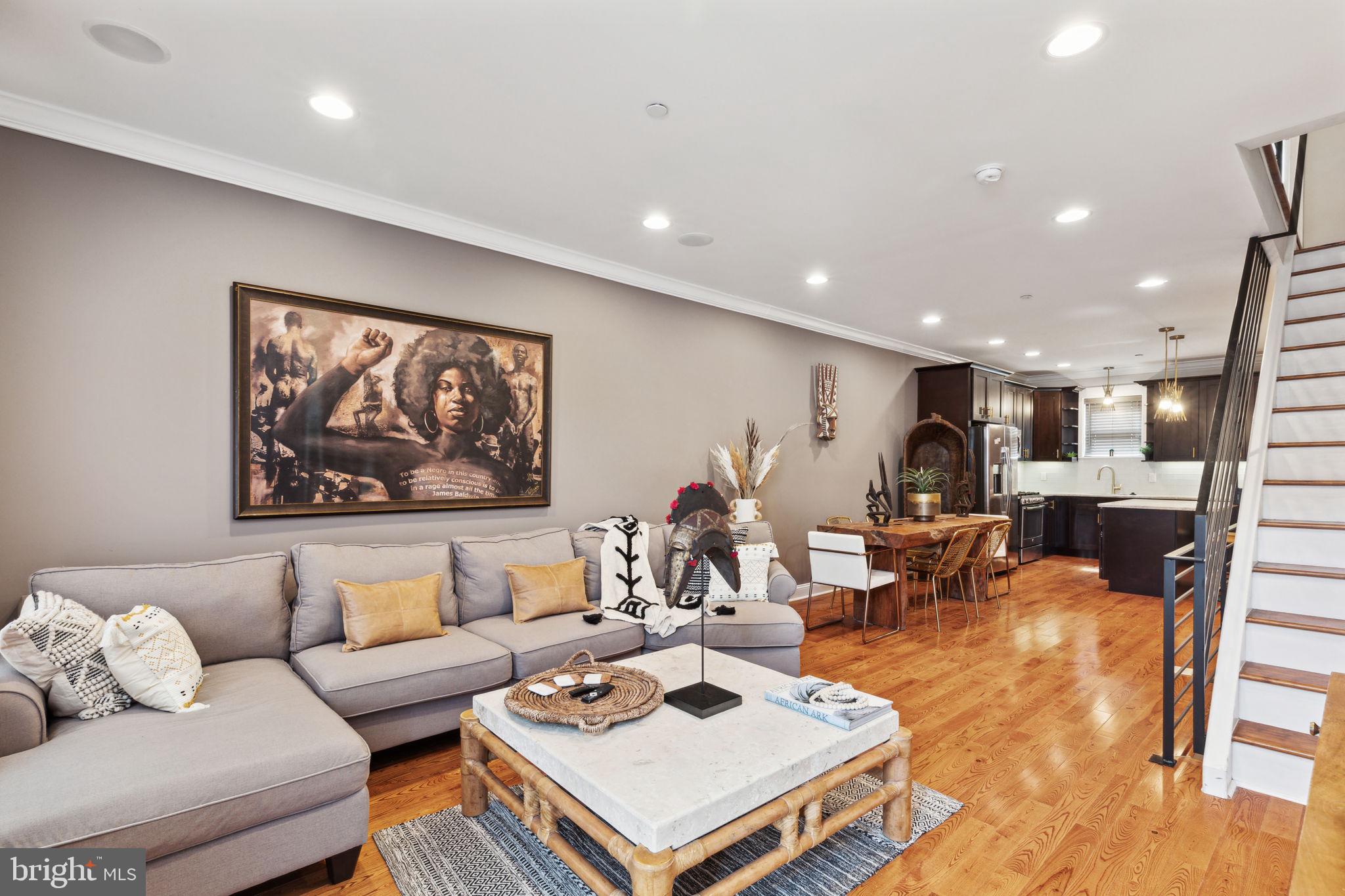 Welcome to your new home in the heart of Fishtown, just steps away from Frankford Ave! This stunning luxury townhome, part of a 2016-built collection, offers two outdoor spaces, a fully finished basement, and modern amenities throughout. Nestled on a tranquil street and adjacent to Kern Park—a charming community green space with garden beds, trees, and neighborhood events—this home offers a perfect blend of city convenience and peaceful retreat. Inside, you'll be captivated by the high-end finishes, including a custom kitchen with granite countertops, stainless steel appliances, rich espresso cabinetry, and a stylish tiled backsplash. With 2,300 sqft of luxury living space, this home can accommodate all your needs, whether it’s a home office, gym, or room to grow. The finished basement, complete with a full bath and tiled shower, provides additional versatile space. Step outside to your private, fenced-in patio or head up to the rooftop deck to soak in panoramic skyline views. The patio offers convenient access to a gated breezeway, making it easy to store bikes and take out trash without passing through the house. Built on an extra-wide, deep lot, this home boasts high ceilings, spacious rooms, built-in ceiling and surround sound speakers, an alarm system, and tray ceilings with custom lighting in the master suite. A wet bar on the third floor adds a touch of luxury. Located in one of Philly’s most vibrant neighborhoods, you’re just a short walk from fantastic dining and shopping. You’ll be close to iconic spots like the Fillmore, one of Philadelphia's premier music venues, and La Colombe's flagship café.