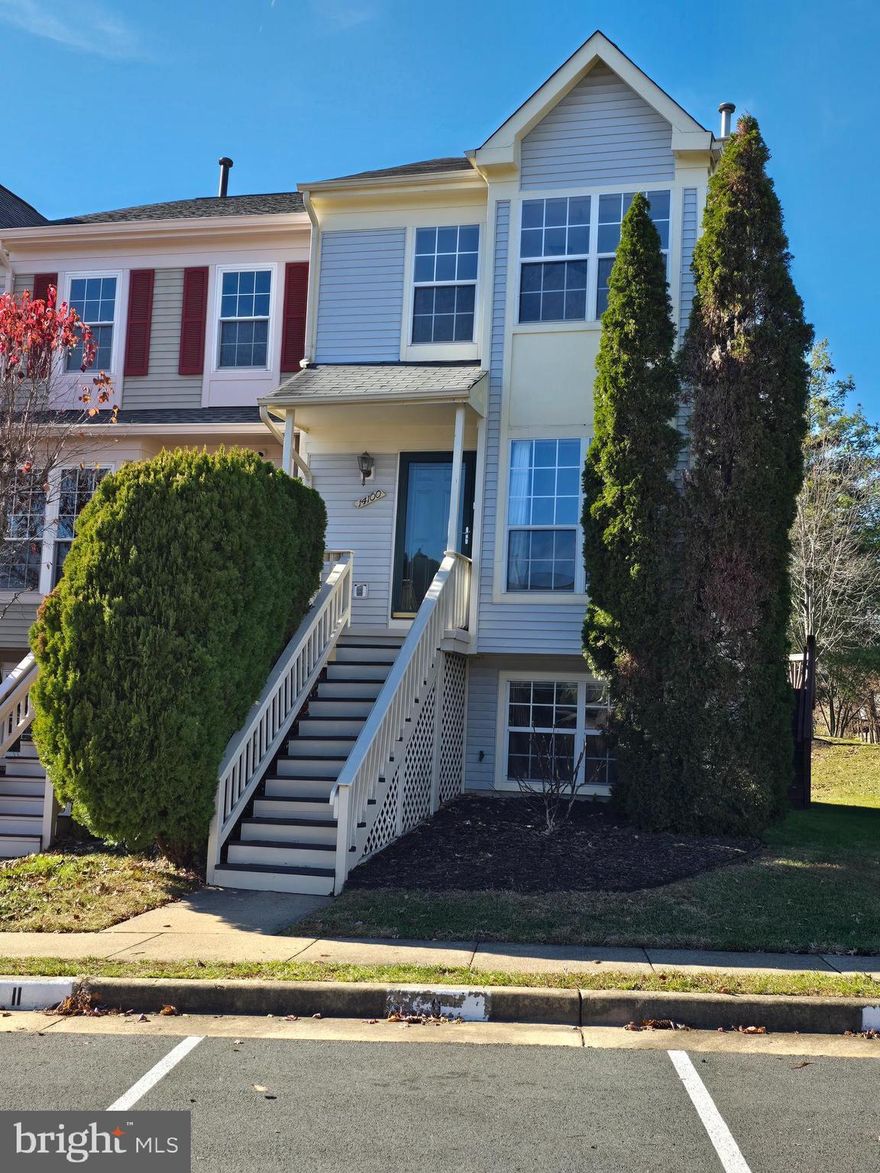 Welcome to 14100 Autumn Circle, a beautifully updated end-unit townhome in the desirable Green Trails neighborhood. Situated on a generous end-unit lot, this home offers exceptional privacy and abundant space.
Step inside to find fresh paint throughout and gleaming hardwood floors that flow across the main level. The updated kitchen features granite countertops, providing both style and functionality for everyday living.
Perfect for hosting, the home boasts a large, spacious deck ideal for outdoor dining and entertaining. Upstairs, you’ll find two private bedroom suites, each complete with its own full bathroom. The primary suite includes a Carrara marble sink, adding a touch of luxury. 
The fully finished lower level offers incredible versatility with a third bedroom, a full bathroom, and a separate entrance.
Additional highlights include new carpet on the third level and stairways, freshly painted walls and two assigned parking spaces conveniently located right in front of the home. 
 Move-in ready and thoughtfully updated, this townhome blends comfort, style, and convenience in one exceptional package. The home is conveniently located to I66. The home is also minutes away from shopping and dining experiences.