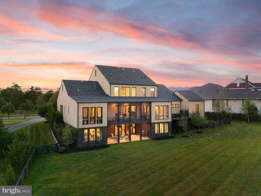 ✨ A Piet Boon Masterpiece in Willowsford – The Grange ✨
Experience luxury redefined in this rare Studio Piet Boon Model Home, perfectly tucked into one of Willowsford’s most coveted locations. This architectural gem boasts four-sided brick construction, a 4-car garage with EV charger, and soaring 10-foot ceilings with expansive 8-foot windows and doors that bathe every corner in natural light.

Inside, sophistication meets warmth. A private home office with custom built-ins sets the stage for productivity, while the dramatic two-story family room with a sleek linear fireplace invites relaxation and connection. Walls of multi-slide glass doors vanish to reveal a covered deck with its own fireplace—now elevated with a beautifully finished tongue-and-groove ceiling that extends to the front porch and lower stone patio for a seamless, timeless look.

The European-inspired kitchen is nothing short of a chef’s dream: Viking appliances, marble waterfall island, Butler’s Pantry with beverage center—all designed for culinary brilliance and effortless entertaining. The renovated mudroom, complete with its own refrigerator and custom cabinetry, blends everyday function with elegant form.

The first-floor Owner’s Suite is your personal retreat, complete with a sitting area, spa-style bath, and expansive custom walk-in closet. Upstairs, you’ll find three additional bedrooms and two full baths, offering comfort and privacy for family or guests.

The fully finished walk-out lower level is entertainment central:
🎬 Private movie theater
🥂 Wet bar with linear fireplace
💪 Professional-grade gym, fully outfitted with mirrors
🛌 Guest suite with private bath
🍿 Media and recreation rooms
🧺 Secondary laundry room with added refrigerator

Outdoors, the upgrades continue with a brand-new rear deck, a fenced-in yard, and extensive professional landscaping featuring trees, shrubs, and lush plantings for privacy and beauty year-round.

With two kitchens, two laundry rooms, a 4-car garage with EV charger, multiple outdoor living spaces, and high-end finishes throughout, this home is as practical as it is breathtaking. And with its private setting just steps from the Sycamore Clubhouse, pool, and Willowsford’s beloved farm stand, it simply doesn’t get better.

🌟 A rare opportunity like this won’t last long—schedule your private tour today! 🌟