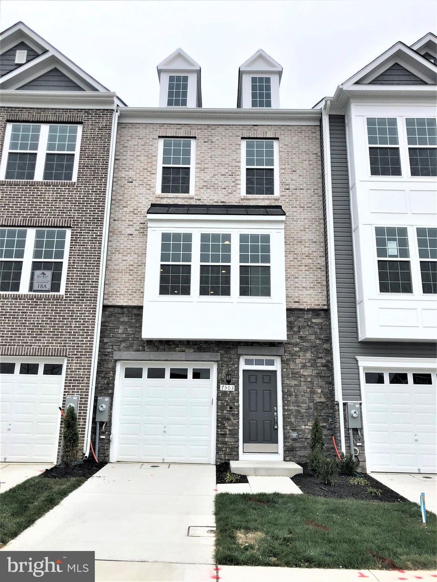 Ready For Move-In! Brand New brick & Stone front townhome in Glenn Dale Crossing with a grassy back yard that can be fenced in! Walk inside to be greeted by the large rec room on the main level. Upstairs, you will find a spacious Kitchen that opens up to the living area! Upgraded flooring has been added throughout the home. Conveniently Located in Lanham. 8 Minutes from Greenbelt Metro, 5 minutes to the Beltway/Parkway, Walk to Retail. Quality construction. Schedule your tour today!  *photos may differ from actual home*
