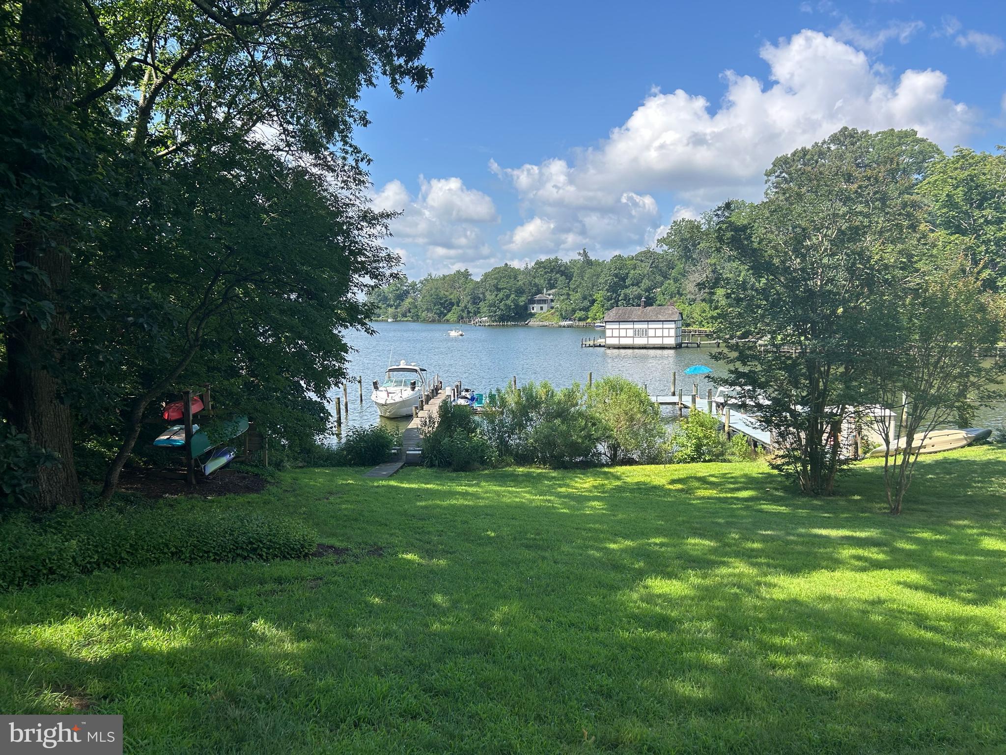 Incredible waterfront apartment available for rent. This unit has been fully renovated and features a gourmet kitchen with granite countertops, custom cabinetry and high end stainless appliances. Directly off the kitchen there is a large area for a dining room table. There is a huge Living room with walls of glass to take in the breathtaking views of Crab Creek. Additionally, there is a wood burning fire place for those cold winter nights. Primary bedroom features screened in porch with unparalleled views. Guest bedroom features new flooring and ceiling fan. Both baths have been fully renovated. Rear bath features double vanity with granite top and incredible shower with custom tile work and multiple nozzles . Laundry area with storage. Incredible huge patio is perfect for entertaining and you won't believe the views. Storage is available for tenant above the garage. The tenant will have access to the patio, backyard and pier upon signature of liability waiver. Perfect spot to drop a kayak in. The tenant will have the opportunity to store a SUP board kayak on the kayak rack. The tenant also has two designated gravel parking spots in front of the home. PLEASE NOTE THIS IS A MAIN LEVEL APARTMENT IN THE REAR OF THE PROPERTY. The owners retain use of the upper two levels and use this residence as a second home. Tenant to be responsible for 1/3 of the utilities (electric, oil) tenant responsbile for 1/2 of internet/cable.