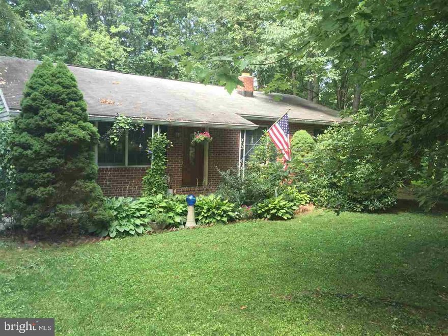 Parklike setting on a private cul de sac, high end touches inside, beautiful views from the large deck, overlooking the wooded half acre lot. Porcelain tile floors and granite counter tops in the kitchen, new hardwood floors in the dining and living rooms, Anderson custom windows.  Bath has marble floor and granite countertop, silk wallpaper in the dining room. Must see, too many upgrades to mention.