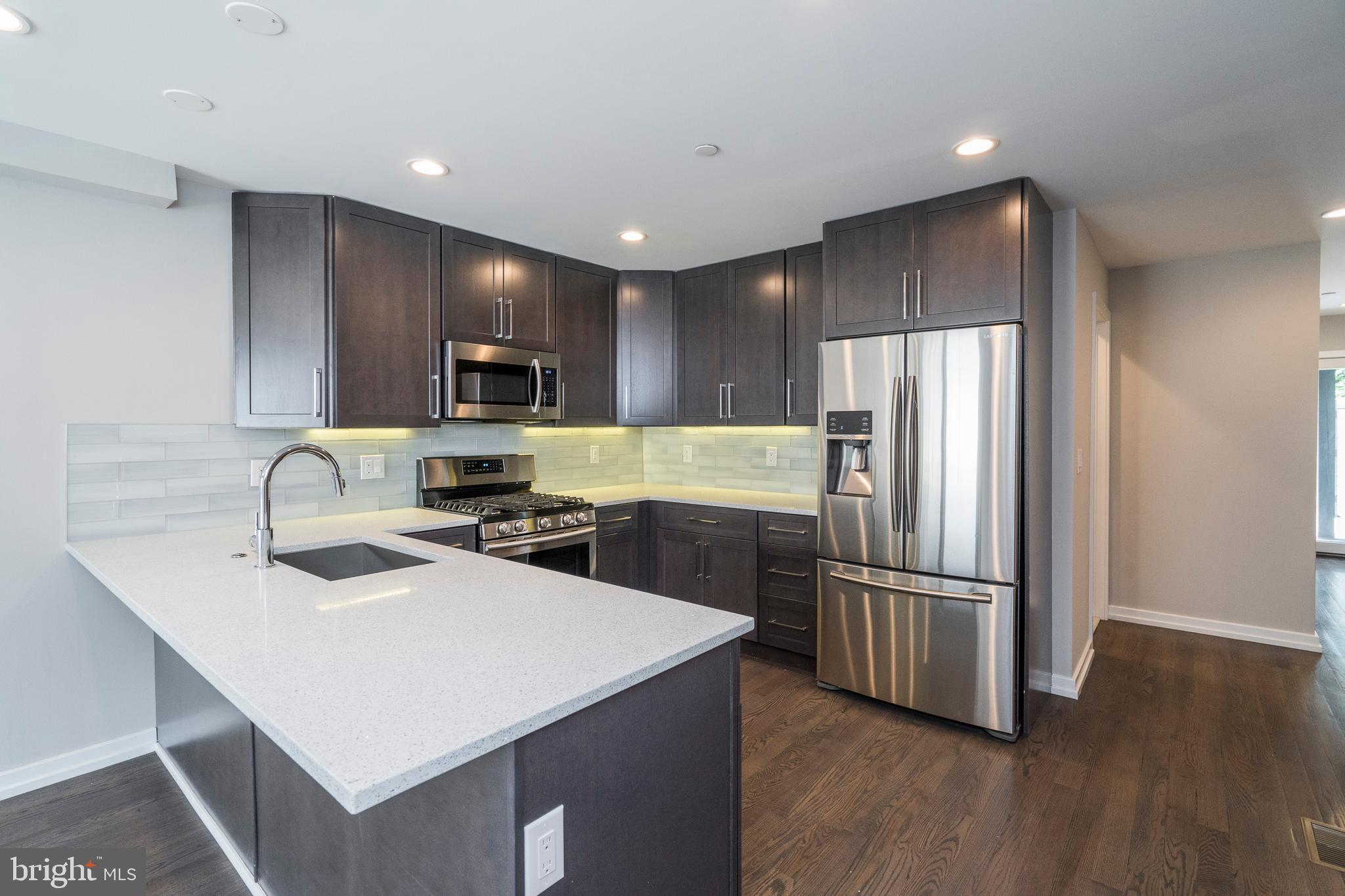 This stunning newer construction building in Graduate Hospital offers luxurious space at a great value. Enter your brand-new home and immediately notice the great natural light from the large windows. Step across the fine hardwood flooring to your modern kitchen, featuring all stainless Samsung appliances, quartz counter tops with bar seating, and ample cabinet space. NEST Thermostats, hard-wired speakers in the ceiling, private patio, and Video Intercom to the front entrance are just some of the many features of this condo. Unit 1 features three bedrooms and three full bathrooms which offer fantastic tile, a tub, shower and vanity. Prime Location! This property provides easy access to restaurants, shopping, schools, public transportation and much more. Easily walk to the Center City, the Broad Street Subway, Rittenhouse Square, and the Schuykyll River Trail. Great access to Penn, Drexel, and CHOP. Close to I-76 and I-95 for an easy commute out of the city. Located in the Greenfield Catchment. Don't miss a great opportunity to live in this one of a kind building.
