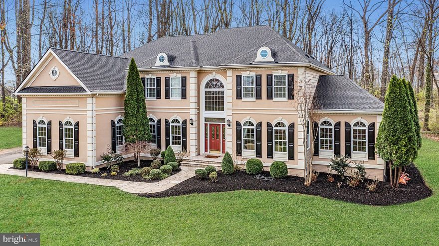 Location, Location, Location. Prime lot backing to woods and located in the private and remote section of Wright Farm Estates. Original owners have upgraded and maintained this beautiful home which features drop-dead gorgeous wide plank historic hardwoods throughout most of the main level.  Enter into the two-story foyer and you'll immediately see an oversized private office big enough for two desks! The formal living and dining rooms are adjacent to a large sunroom featuring 3 walls of windows. The enormous gourmet kitchen features an incredible amount of cabinetry, a newer high-end stainless steel refrigerator, a high-efficiency dishwasher, 2 ovens/built-in microwave, a state-of-the-art warming tray, gas cooking, granite countertops, and today's sought-after kitchen trend, a double built-in pantry. It is a gourmet cook's dream kitchen! Stunning 2-story family room with expansive windows emitting gorgeous natural light throughout the home. Main-level gas fireplace, powder room, and laundry/mudroom that leads to a large 3-car garage. Two staircases, both with classical iron balusters,  will lead you to the upper level where you'll find 4 generously sized bedrooms and 3 full baths including an oversized primary bedroom suite and luxury bath featuring a coffee bar and double-sided gas fireplace. Finished lower level recreation room, full bath, and lots and lots of storage. The backyard is chock full of mature trees that offer privacy and lots of room for exploration.  Fully fenced lot with stately electronic front gate. Newer hardwoods, new carpeting on the entire second level, newer appliances, designer paint, brand new roof with warranty, 3 new high-efficiency HVAC systems.  Newly painted exterior, arched windows, and elegant rooftop dormers. Wright Farm is nestled in the country, yet is just under 2 miles from grocery stores, restaurants, and shopping. This neighborhood is established and highly desirable. Priced to SELL!