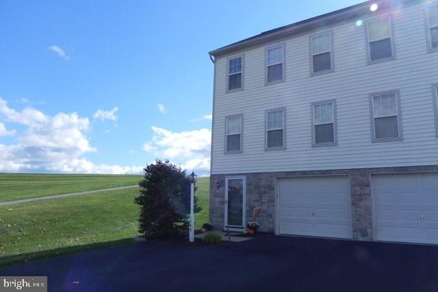 Wonderful end unit townhome with huge open side yard area. Home backs up to open area and walking trail and close to Stillmeadow park. Oversized freshly sealed driveway can accommodate 4 cars plus 2 car tandem garage. Home is true 3 bedroom with new laminate in 2 bedrooms and both baths. Directly across from parking lot for tons of guest parking. Convenient to Rtes 30 and 83. 3rd floor bedroom has vaulted ceiling. Move in condition....Hurry!!