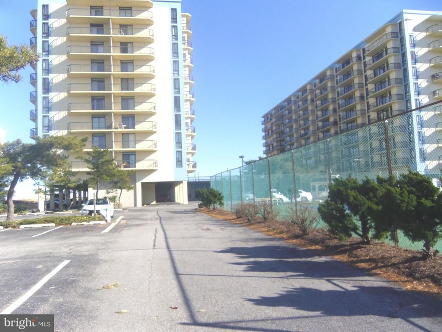 BACK ON MARKET DUE TO BUYER FALL THRU on April 19th.  Don't miss out on this magnificent updated 4/5 bedroom direct oceanfront unit with panoramic near 360 degree views of the Atlantic Ocean as well as Assawoman Bay from 3 separate large yet private balconies! This rarely available 2271 sq. ft., double unit  9th floor penthouse beauty boasts Decorator furnishings*Huge sunken living room* Attached family room/ 5th bedroom au pair with balcony. breakfast bar, half bath and retractable door * Upgraded white kitchen with all appliances and solid surface countertops* Fabulous formal dining room* Separate laundry with washer and dryer* Primary oceanfront bedroom suite * Primary bath with separate tile shower and walk- in closets* Additional 3 large bedrooms ...2 with balcony access* Neutral Coastal decor throughout* Come and fall in love with your home at the beach. LOCATION... The unit is conveniently located near the Ocean City, MD and Georgetown, DE airports for private and corporate travel as well as Salisbury, Baltimore, Philadelphia and Atlantic City airports. Whether for business, pleasure, entertaining, or quiet relaxation...this penthouse has it all. Looking for an investment property? This space had summer rentals from June through August, generating approximately $50K . Owners utilized it as a home office during the cooler months. Additional amenities include 2 separately deeded covered parking spaces (N-48 & N-50) next to front door building entrance as well as additional parking in the spacious lot. And, of course, don't forget the pool, sundeck, tennis courts, game room and security. You choose...home or investment...either way you win. Condo fees based on double sized unit.  SELLERS WILL PROVIDE  1 YEAR PRE-PAID CONDO  FEES FOR BUYER  WITH ACCEPTABLE CONTRACT OF SALE. This is truly a spectacular buy.