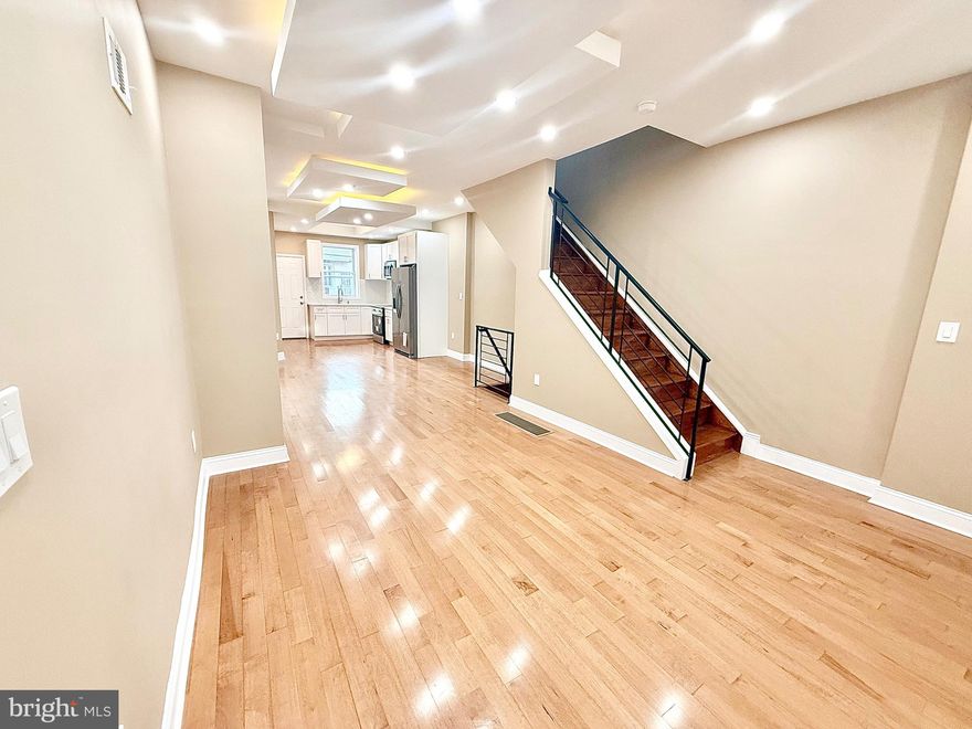 Welcome to this beautifully renovated 3 bedroom, 2 bathroom home in the heart of the Logan neighborhood just minutes from Hunting Park Pool and Hunting Park. This home perfectly blends modern design with classic Philadelphia charm. Step inside to a bright living space featuring recessed lighting, rich wood style flooring. A full bathroom in the basement adds convenience for guests or flexible living arrangements. The open floor plan gives the house a seamless flow which creates a perfect space for entertaining or relaxing. The kitchen is complete with white cabinets, sleek quartz countertops, new stainless steel appliances, and with recess  lighting  that ties the space together beautifully. Upstairs, you'll find three  bedrooms filled with natural light and ample closet space, along with a fully updated bathroom featuring  contemporary fixtures, and modern vanities. Step out back to a private fenced yard, perfect for outdoor gatherings. This move in ready home offers modern style, comfort, and convenience a true gem in one of Philadelphia's fastest growing neighborhoods. Don't miss your opportunity to make it yours!