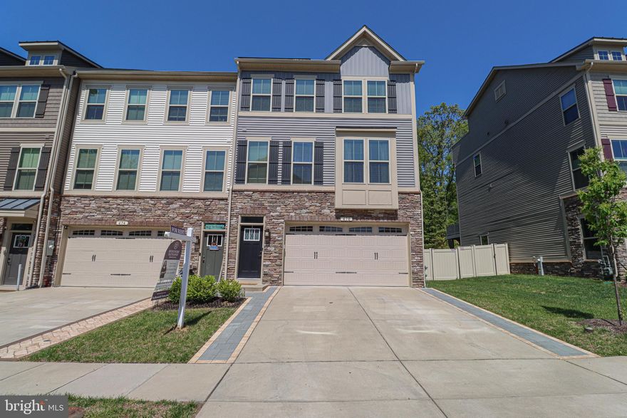 Welcome to this stunning end unit townhome with 2 car garage located in the heart of Millersville's Pondview community — just a short distance to the community center and pool!  Backing to trees, you’ll love the peaceful view from the deck and the fully fenced back yard.

The main level offers an open floorplan with tons of natural light. The gourmet kitchen features a huge center island with breakfast bar, granite counters, stainless appliances, a double-door pantry and a handy office nook.  The kitchen flows right into the spacious and sunny dining room, both with LVP flooring, and to the supersized living room — all perfect for everyday living and entertaining.  There’s also a convenient half bath on this level.

Upstairs, the primary suite offers a large luxury bathroom with dual vanities, a soaking tub, and separate shower with ceramic surrounds and flooring. You’ll also find two additional nicely sized bedrooms, a second full bath with ceramic tile flooring and shower surround, and an upper-level laundry room.

The lower level includes access to the garage and a big bonus space—use it as a family room, or a 4th bedroom. There’s also a full bath with dual access and a walk-out to the backyard.

This one has it all.  Come take a look!