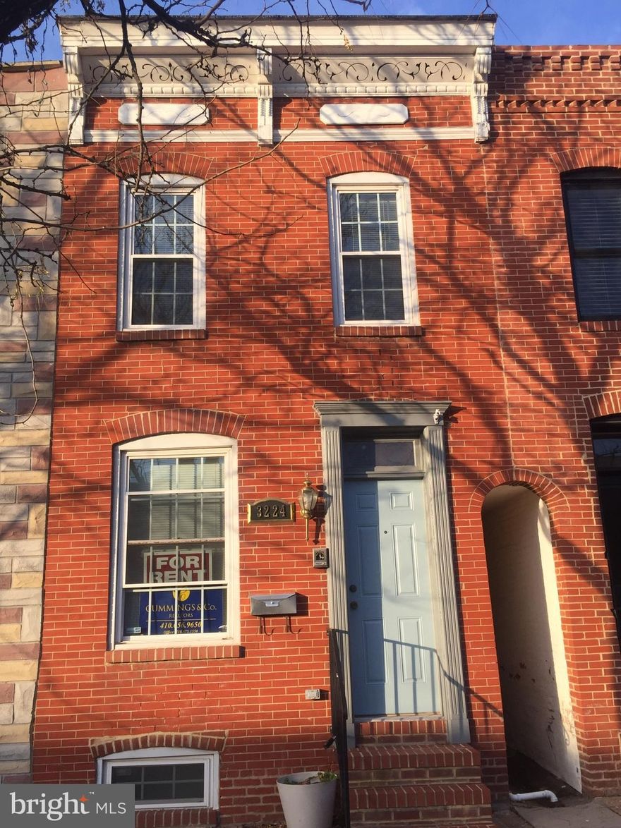 Updated home just blocks to the square &  waterfront! Open 1st floor with hardwood floors, exposed brick, and fabulous kitchen with stainless steel appliances, granite  & loads of cabinet & counter space. Two large bedroom suites upstairs and 3rd bedroom & full bath in lower level make this home ideal for sharing. Interior access to rooftop deck off of hall with views over Canton. PARKING PAD & easy parking on this block.