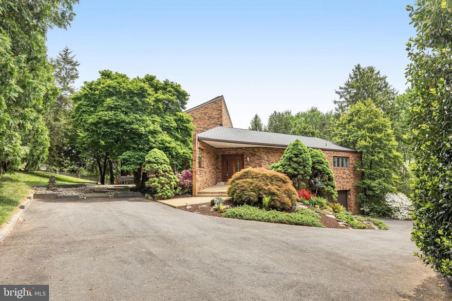 Welcome to this one-of-a-kind contemporary home in the lovely Windy Hill Neighborhood of McLean. The home is beautiful, and unique, and is sits on a .75 acre lot with park-like surroundings. The home has been updated through the years, and boasts 4 generous bedrooms and a modern, open floor plan. As you enter, the sightlines take you through to the wonderful natural light provided by the wall of windows that is the back of the home. To the right, you enter a formal intimacy of the spaces living room which is open to the kitchen and dining area. The kitchen has tons of counter space, high-end appliances, and a large pantry. This is a chef's dream!! The intimacy of the spaces is ideal! You are also connected to a spacious deck that overlooks the property and huge pine trees that provide the privacy you need!
The Great Room is amazing, with a gas fireplace and a wall of windows that provide more views of the property. the room also has plenty of wall space to display art and family photos! The primary is on the main floor, and is huge! The closet is custom and has plenty of space, and the bathroom is everything you need!
Upstairs, there is a nice loft that can be an office, homework nook, or just a lounge, along with 2 bedrooms and an updated bathroom. The basement is open, with plenty of room to carve out a rec room, or whatever you need! Walkout to the yard here, and also enter the 2 car garage. In addition, the 4th bedroom provides a private oasis, with its own private, updated bathroom, as well. There is also ample storage and the laundry on this level. 
This home is so unique, you must visit it to understand it's true glory! The space and the flow is great for entertaining, and the property is lush and private. There is a cohesion with the exterior and interior that is so pleasant! The location is amazing, as well, with easy access to Tyson's, commuter routes, downtown McLean, DC, and so much more! Come see what 1355 Windy Hill has to offer for your next dream home!!