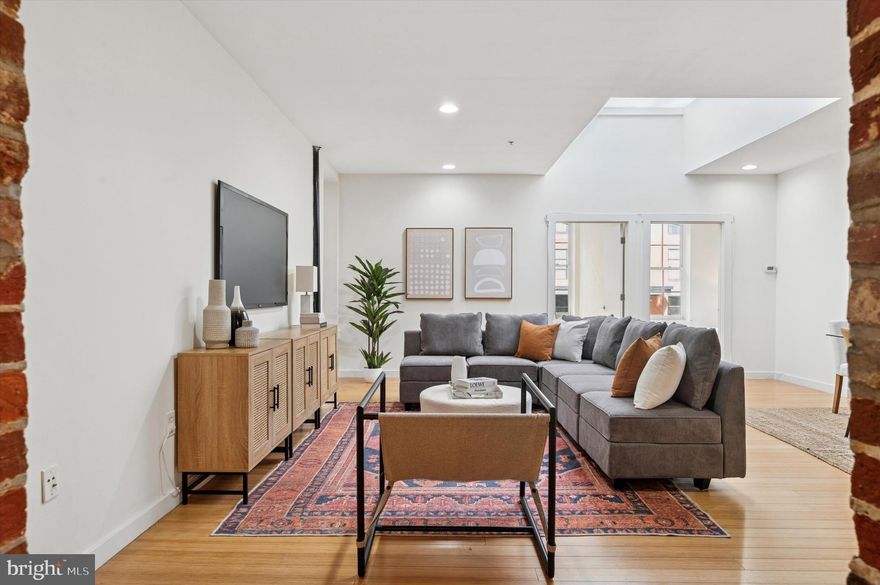 Welcome to 209 Cuthbert Street, Unit 104!  Located in a boutique loft building on a quaint side street in the heart of historic Old City, Philadelphia, this spacious 2 bedroom, 1 bathroom condo expertly blends modern amenities with historic industrial charm. As you enter the home, you’ll be greeted by the stunning exposed brick pillars that frame the large foyer. Two sizable closets and ambient lighting complete the entryway. Up a small flight of stairs is the expansive, sunlit living and dining area, perfect for entertaining. Exposed brick walls, exposed ductwork, beautiful hardwood floors and a large skylight highlight the truly unique space. The galley style kitchen offers plenty of storage and makes meal prep easy. It features wood cabinets, a sleek countertop and stainless steel appliances. Oversized windows, hardwood floors, an exposed brick wall and an ample sized closet complement the bedrooms located off the main living area. The bathroom has a subway tiled bathtub and has been newly updated with a crisp white vanity and double sconces. The Bosch washer and dryer are stacked in the bathroom and a storage locker is in the basement. The building features a shared roof deck to bask in the fresh air while enjoying the beautiful skyline and river views. With a neighborhood walk score of 99, you’ll enjoy the easy convenience of city living with close proximity to Old City’s best restaurants, shops, art galleries, historic attractions and public transit. This home makes traveling a breeze with its accessibility to I-95, 676 and the Ben Franklin Bridge. Experience life at the Cuthbert Lofts, where history meets modern living.