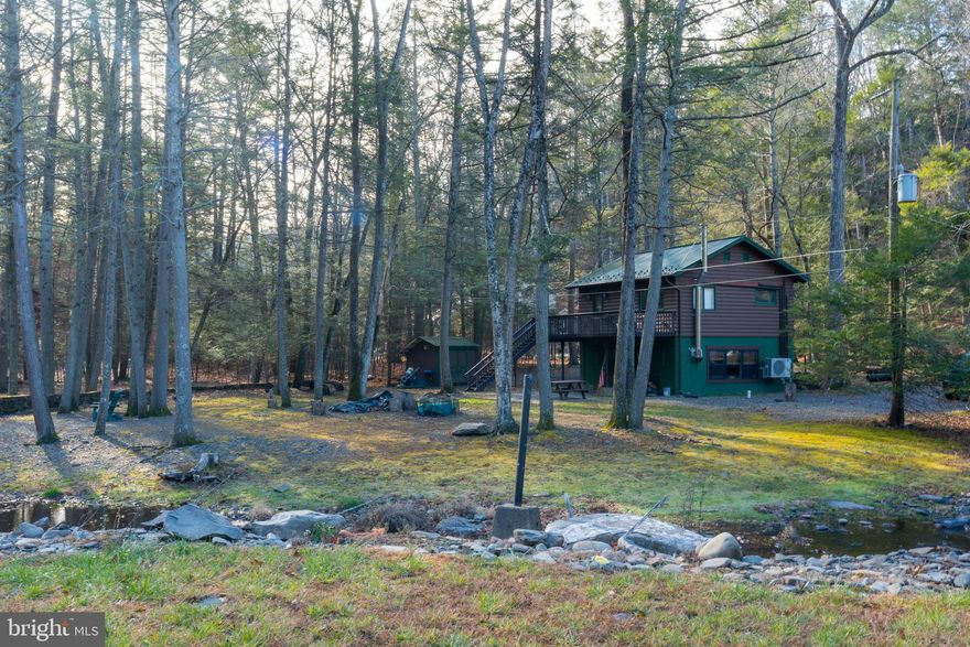 Welcome to a once a lifetime opportunity to own a Pocono paradise, approximately one hour from the New York boarder, with astounding creek side mountain valley experience. Where you own your own log cabin experience, and an income producing home, that makes it a compound for when you want to use it or other options. SPR permitted with registration/fee in a combination where privacy is unparallel. In what many call this high energy healing location, these inviting properties offers an exciting blend of adventure and relaxation in every season which offers something special, and unique where you can unplug and experience nature, as sellers have for the past 50 years. During which time we have updated this authentic log cabin, natural and manmade stonework and so many features too much to list. On the northeast class A accredited trout stream. 

Year-round enjoyment awaits, cozy winter evenings by the fire or skiing at nearby Shawnee Mountain, and cool summer days along the Bushkill River for fishing, canoeing, kayaking, or simply unwinding outdoors.

2138 Bridge Side Dr with recently renovated modern luxurious 1,144 SQFT.  Features granite countertops, an updated kitchen and bath, split-unit heating and cooling, 2 bedrooms, 1 full bath, and a deck overlooking scenic water views with the soothing sound of the river close by.

Conveniently located approximately 1 hour to the Pocono Mountains and Lehigh Valley Hospital, under an hour to Allentown and Bethlehem, with easy access to I-80 and nearby Stroudsburg’s dining, arts, and shopping.

Don’t miss this unique chance to own this property in one extraordinary setting, schedule your private tour today.
