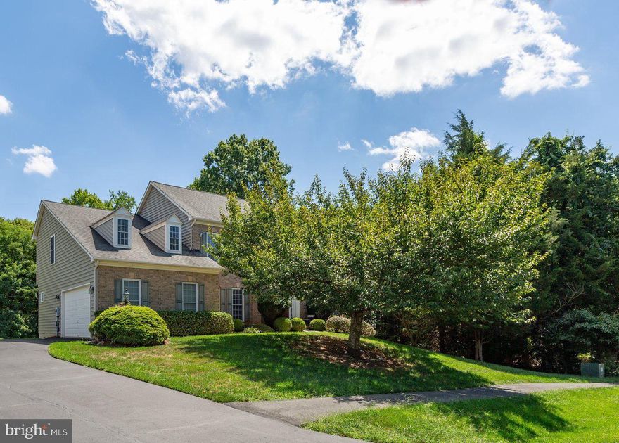 One of the most stunning lots in all of Brookside!  The truly wooded expansive back and side yards make it feel as though you've stepped into your own private oasis.  Yet, you can still benefit from all that the Brookside community has to offer.
A rare opportunity to own in the coveted  Reserves section of Brookside, this home is thoughtfully crafted with superb structural upgrade choices. When you enter into the vaulted foyer, you will see genuine hardwood flooring throughout the entire main level.  The whole home has been custom painted in a neutral tone (August 2023). The more traditional flow offers a dining room, living room, office (with doors), family room with real wood burning fireplace, kitchen with large island, mudroom, and sunroom/morning room addition.  This traditional, yet open layout provides the thoughtful option of turning the office and/or formal living room into a main floor master to suit any and all needs.   The upstairs has a master suite on one side, with three generous size bedrooms on the other wing, providing ample privacy.  One bedroom is a princess suite with full bathroom, while the other two bedrooms share a large jack-and-jill bathroom space.
The basement is already finished and ready for you to apply your personal touches.  In the basement you will find open rec room style  spaces as well as a movie theater style room and full bathroom.  With a gas fireplace and living room area, this basement could provide an au-pair or in-law suite immediately upon move in.  Exit the basement onto the stone patio and enjoy the wonderful backyard that feels like a wooded park.
Take time to relax on the composite deck with vinyl rails, and listen to the quiet sounds of nature.  At Tulip Hill, you will feel removed from the hustle and bustle of every day life.  But, being on the DC side of Warrenton provides multiple commuter routes for the times you do have to leave home.  Explore the miles of trails, preserved areas, lakes, neighborhood pools, playground and recreation spaces and so much more that Brookside has to offer.  Conveniently located on the border of Gainesville and Warrenton, shopping, running errands, and enjoying all both towns have to offer is a breeze. Explore historic Vint Hill with quaint shops and restaurants, breweries and wineries. Come tour Tulip Hill and imagine making it your forever home!
* photos coming this week - drone footage - 3D tour - virtual staging of some rooms *