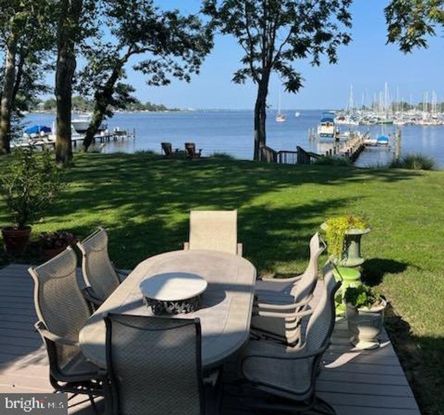 Boater's paradise! Stunning 3600 Sq. Ft Colonial  Waterfront  Home ,with a 2 Car Garage, with some of the Most Beautiful  180 degree Water Views, The Waterfront  features 135 Ft Bulkhead Shoreline , with 12 foot Sailboat depth slip, Electric and Fresh Water on  the Dock, 2 Boat Lifts and 2 Heavy Duty Davits, This 230 Ft Dock has been recently  Refurbished .
The Home Features a 2 Story Foyer with Marble Flooring as you the enter , Stainless Steel Appliances, Granite Countertops ,Ceramic Tile, Hardwood Floors ,Waterfront Patio, A Considerably  Spacious Owner  Suite with a  14x16 Sitting Room off the Primary Bedroom with Luxury Bathroom , Enjoy your morning or evening beverage on the 10 Ft. X 30Ft.  Waterfront Deck off the Owner's Suite with Fabulous Waterfront  Views and so Much More!