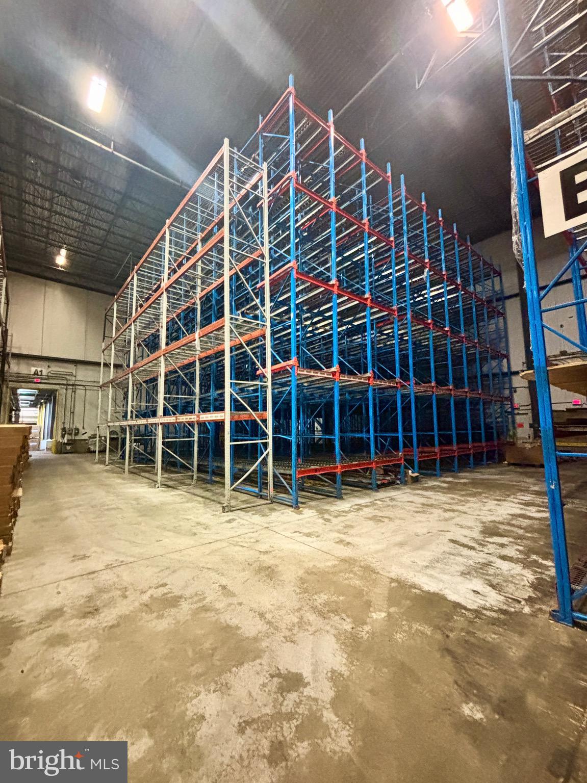 Positioned on a key corridor in Lancaster City, this property offers a near turn-key storage opportunity with racking in place to support 600+, 6' tall pallet positions in a space featuring 38' ceilings. Formerly used for storage by the Kunzler hot dog company, while not currently cooled the building is tightly insulated and conducive for conversion to temperature sensitive uses. Whether you’re scaling distribution, expanding regional reach, or seeking overflow capacity, the property offers a strategic location and ready-to-use infrastructure to accomplish your goals quickly.
The space features multiple loading docks with doors measuring 11'x8', and levelers make for efficient logistics. Note that the existing racking is included in the rent price, and can be removed if not conducive to a desired use.
The amount of space offered is flexible, can be less for those on a tighter budget, or much more; another 50,000 square foot space on site is available as well, plus owners can build to suit much more space.
CAM fees will start at $1.50/SF. The owners would prefer a lease to be a minimum of 5 years and are willing to sign on for much longer than that.
Included in the lease are 4 dedicated parking spaces, with abundant additional spaces available for $50/month each.
With light upgrades this can easily become a clean, efficient, and highly functional storage or workspace. The space is located next to what will become the headquarters for Topline Heating & Air, and provides an opportunity to get in at a lower price before the property is greatly improved. Take your opportunity to be positioned in the path of growth!