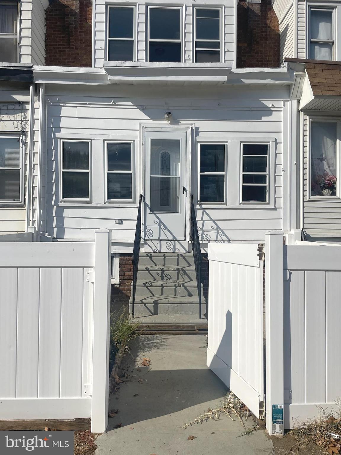 I want to share a new listing in Southwest Philadelphia that I think you might find interesting. This home has a charming curb appeal with a classic white picket fence.
As you step inside, you'll find a lovely enclosed front porch, perfect for use as an extra sitting area to relax or greet guests. The interior boasts stylish laminate plank flooring throughout the main living spaces, complemented by modern recessed lighting. The kitchen features bright white cabinets and easy-to-clean ceramic tile floors. Downstairs, the fully finished basement offers valuable additional living space, complete with ample storage and a convenient full bathroom. Upstairs, there are three well-proportioned bedrooms. The primary bedroom is a highlight, offering a desirable walk-in closet for all your wardrobe needs.
The location of this property is also a major plus. It's situated close to the vibrant Baltimore Avenue corridor, where you'll find a variety of shops and restaurants to explore and enjoy. For those who appreciate the outdoors, the home is also conveniently located near the beautiful Bartram's Garden and the popular Clark Park.
This property is tenant occupied on a month to month lease. The house will be vacant upon settlement.