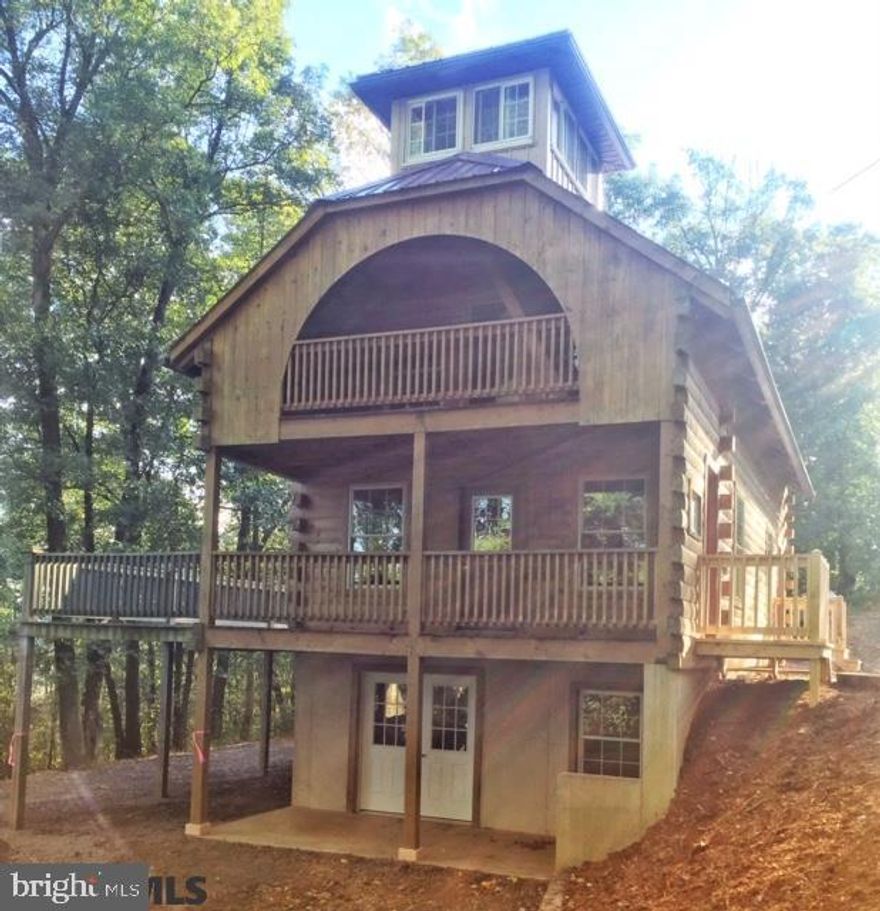 This gorgeous pristine log cabin is nestled in the beautiful woods of Central PA on 3.35 acres. It features 2 bedrooms, one 1/2 bath with plumbing to add a shower or tub, on-site septic and a new well. There is a large wrap around deck, perfect for sitting with a cup of coffee on a brisk fall morning while enjoying the peaceful serenity of nature. R31 insulation in the ceiling, poured walls in the large unfinished basement that features a walk out, and 1 3/4" thick tongue and groove pine floors. No current electric service at the property but options are available. Enjoy the view from the third floor loft with 360 degree windows. This property is adjacent to Rothrock State Forest, state approved snowmobile trails, 30 minutes from State College and Huntingdon as well as 15 minutes from Lewistown. This property is perfect for Penn State fans who are looking to find a quiet home football retreat, a weekend getaway haven for friends and family, or a group of avid hunters.