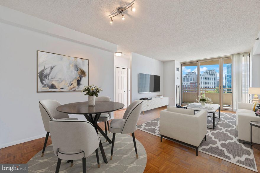 Welcome to this rarely available 2-bedroom, 1-bath corner unit ideally situated in the heart of Downtown Bethesda!  Bathed in natural light from its southern exposure, this beautifully updated condo offers an open-concept living and dining area that flows seamlessly onto your private corner balcony—showcasing the best views in the building. The unit also features real hardwood floors throughout, an upgraded kitchen with granite countertops, stainless steel appliances, and ceramic tile floor and full size washer and dryer in the unit.  The full bath has also been tastefully renovated with granite counters and matching ceramic tile.

The spacious primary bedroom is a true retreat, complete with a custom, built-in wall unit, bay window, walk-in closet, and an additional double-door closet—offering abundant storage and style. Recent updates also include a new HVAC system installed in 2023,  updated lighting and freshly painted. The building itself is secured and monitored 24 hours a day and offers optional garage parking for rent with secure access. Located just three blocks to the Bethesda METRO and NIH, and steps to world-class dining, shopping, and entertainment, this is city living at its finest in one of the area’s most coveted locations....Welcome Home!