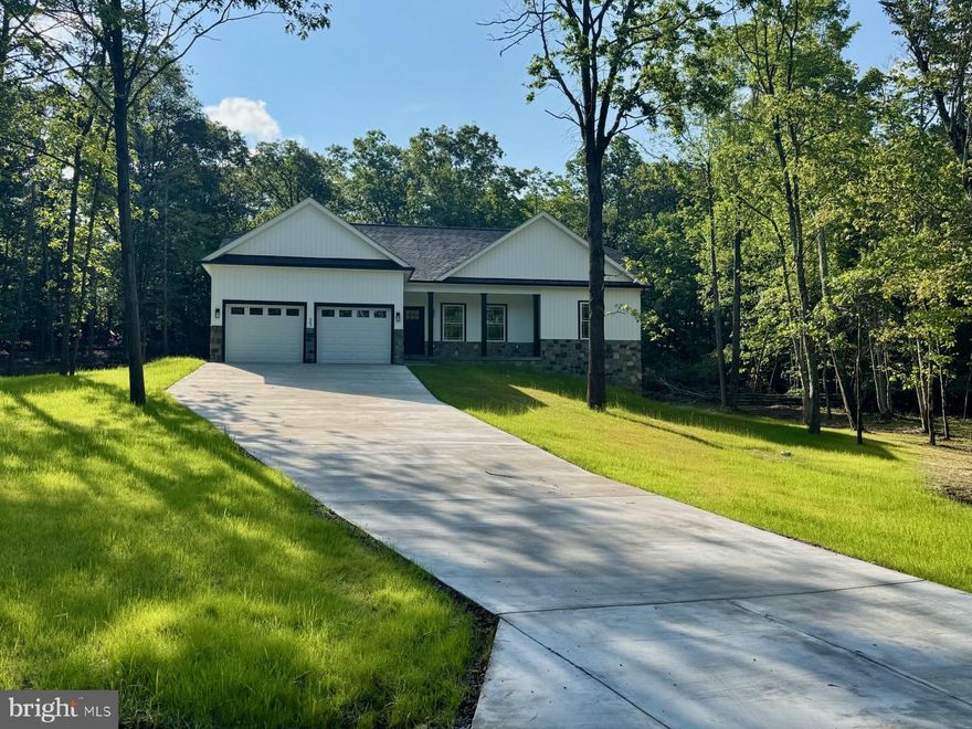 Welcome to Your Dream Home!

Step into this stunning property that perfectly blends modern elegance with thoughtful design on over 2 acres.

**Kitchen (22x16)
Your culinary adventures begin in this spacious eat-in kitchen, adorned with white cabinets and 42-inch upper cabinetry that offers both style and function. Enjoy the ambiance created by custom lighting fixtures, while upgraded stainless steel appliances and a charming farm sink elevate your cooking experience. The ceramic backsplash and Corian countertops provide a sleek finish, complemented by durable LVP flooring, making this kitchen a true heart of the home.

**Living Room (16x22)**
Relax in the inviting living room featuring a cozy gas fireplace framed with shiplap, perfect for gatherings or quiet evenings. With a cathedral ceiling and sealed LED recessed lighting, this space feels airy and open. A ceiling fan adds comfort, while power and cable outlets are conveniently mounted for your wall-mounted television. Plus, the sofa outlet includes USB chargers for your devices, ensuring you stay connected.

**Master Bedroom (15x14)**
Retreat to the master bedroom, where luxury meets functionality. This room showcases a trade ceiling with recessed lighting and an integrative fan light fixture. The spacious walk-in closet, with recessed lighting and hard surface shelving, offers ample storage. The master bathroom is a personal oasis featuring upgraded tile floors and matching sink countertops, a marble surround shower unit with glass doors, and floating shelves for laundry and linens—all enhanced by a custom light fixture.

**Bedrooms Two and Three**
Bedroom two (12x11) is a cozy haven with a ceiling fan and recessed lighting, while bedroom three (14x13) features sealed recessed LED lighting and a ceiling fan light fixture combo, both designed with upgraded trim throughout the home. The double door closet in bedroom three adds functionality to this well-appointed space.

**Hall Bath**
The full hall bath is designed with elegance in mind, boasting upgraded ceramic flooring, stylish lighting, and a matching hard surface vanity top that complements the kitchen and master bathroom.

**Basement**
The unfinished basement (32x54) offers potential galore, featuring additional windows for natural light and a side walkout door. It’s plumbed for a future bathroom, making it a perfect space for expansion.

**Garage (19x20)**
For car enthusiasts or hobbyists, the garage features high ceilings, two garage door openers, insulated doors, and a side exit door, all within a fully finished and painted interior.

**Exterior**
Step outside to discover a delightful 12x14 deck overlooking a full concrete driveway leading to the street, providing both curb appeal and a perfect space for outdoor entertaining.

This home is not just a place to live; it’s a lifestyle. Don't miss the opportunity to make it yours!