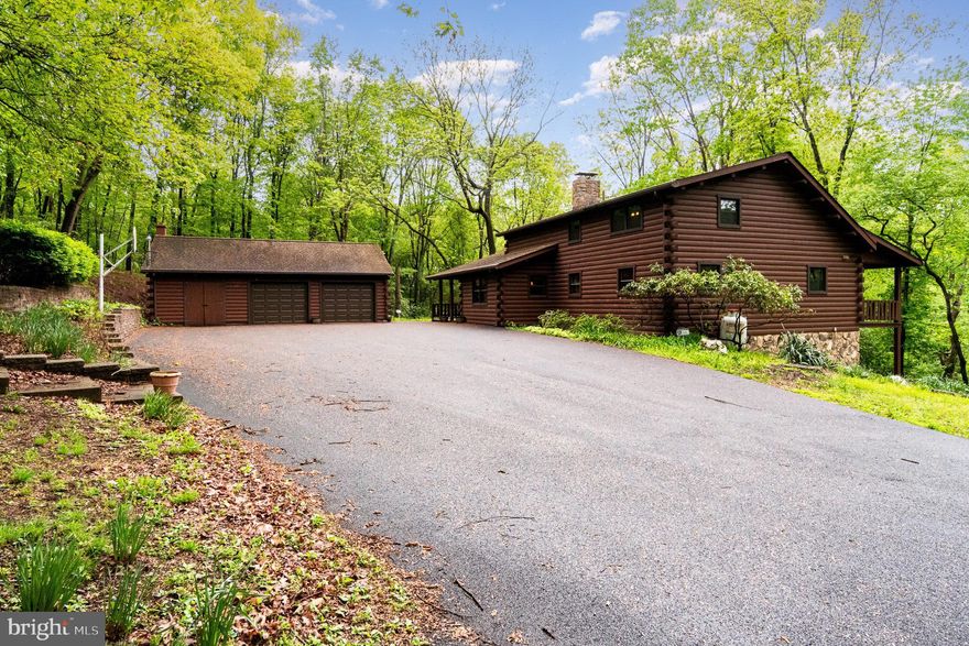 Welcome to your serene retreat nestled in the heart of nature! This charming log home, built in 1986, offers a perfect blend of rustic elegance and modern comfort. With 3 spacious bedrooms and 3 full bathrooms, this residence boasts a generous 3,462 square feet of living space, ideal for creating lasting memories. The loft area offers abundant natural light, making it perfect for an office or den. The primary suite has a vaulted ceiling, skylight, full bath and large walk-in closet. Set on an expansive 4.73-acre lot, this property is a nature lover's dream. Enjoy the tranquility of wooded surroundings, while the picturesque Clark's Creek meanders through the wooded landscape, providing a soothing soundtrack to your daily life. The lot features abundant opportunities for outdoor activities, including fishing and hunting, making it a perfect escape for adventure enthusiasts. The rural location provides a sense of peace and privacy, while still being conveniently accessible to 322 and the Harrisburg area. Imagine waking up to the view of trees and the gentle flow of the creek, inviting you to start your day with a breath of fresh air. The home features a fully finished, daylight basement offering additional space for your hobbies or storage needs. The full kitchen and bath also make this area suitable for an in-law suite. Cozy up by one of the two fireplaces on chilly evenings, creating a warm and inviting atmosphere throughout the home. The screened porch opens to an additional covered porch area nestled among the trees. With a detached 2-car garage providing ample storage and parking, this property is not just a home; it’s a lifestyle. A second outbuilding can be used as a storage shed or kennel. Embrace the beauty of nature and the comfort of a well-maintained log home. Don’t miss the chance to make this enchanting property your own!