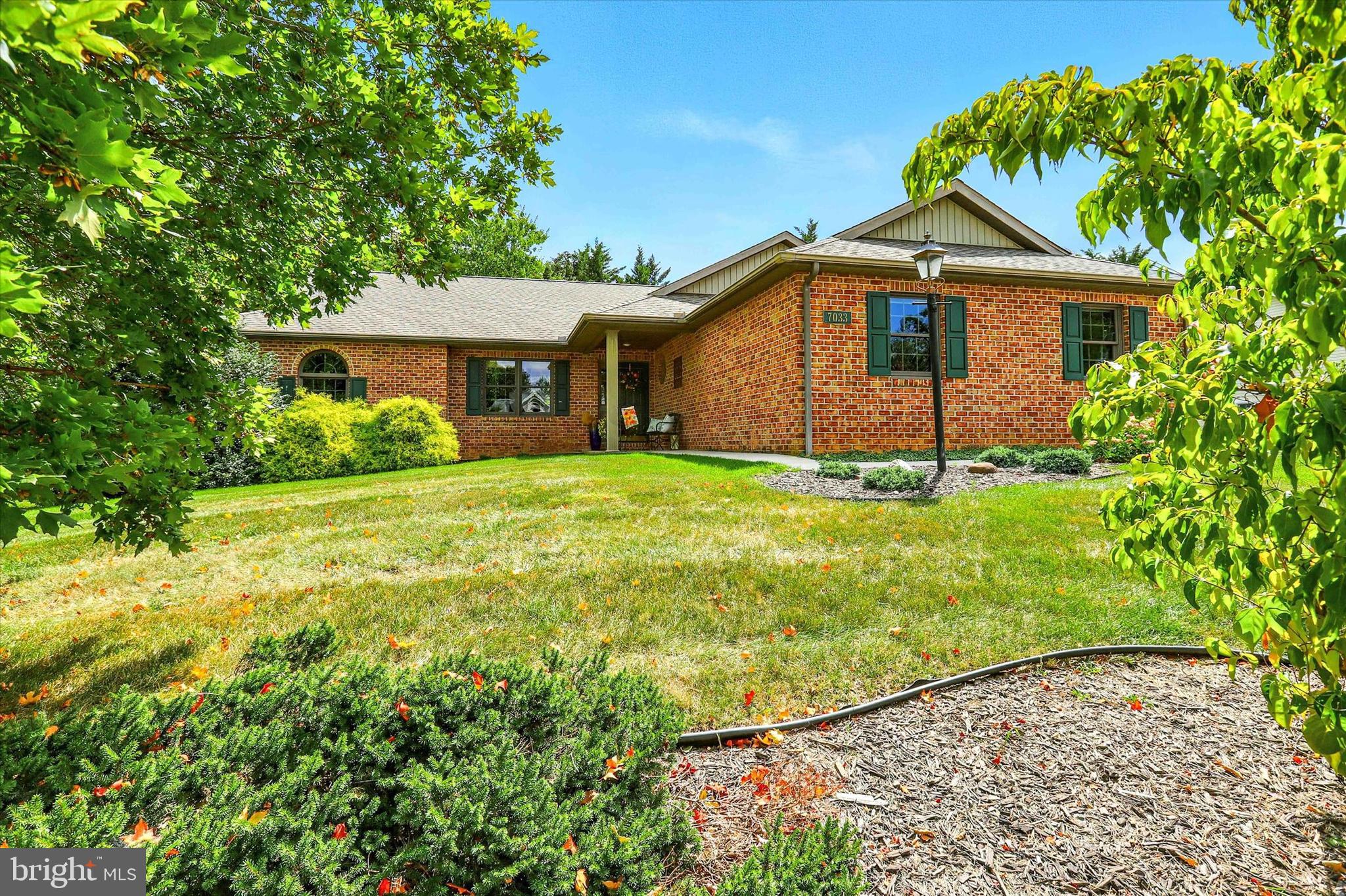 Fantastic home for sale in award-winning Penn National Community! The popular West Wind floor plan allows for easy main level living. Three beds, two baths, and hardwood floors. Brick fireplace is in the family room. Spacious primary suite contains walk-in closet, shower stall, and whirlpool tub. Dining area leads to the screened porch and patio, the back yard is nicely landscaped with mature trees. Plenty of room for entertaining in the finished lower level. Wet bar and billiards room! Lower level contains another full bathroom, and radon mitigation system. Home has easy access to storage throughout, including walkup stairs to attic, from the two-car garage. Additionally, this home has a new roof and a recently replaced HVAC system! Lovely walkable community offers extensive amenities, including 36 holes of 4-star golf, an outdoor pool, tennis/pickleball courts, yoga classes, a community garden, more than 40 social clubs, and a restaurant + bar. For more details on memberships, visit the pro shop!