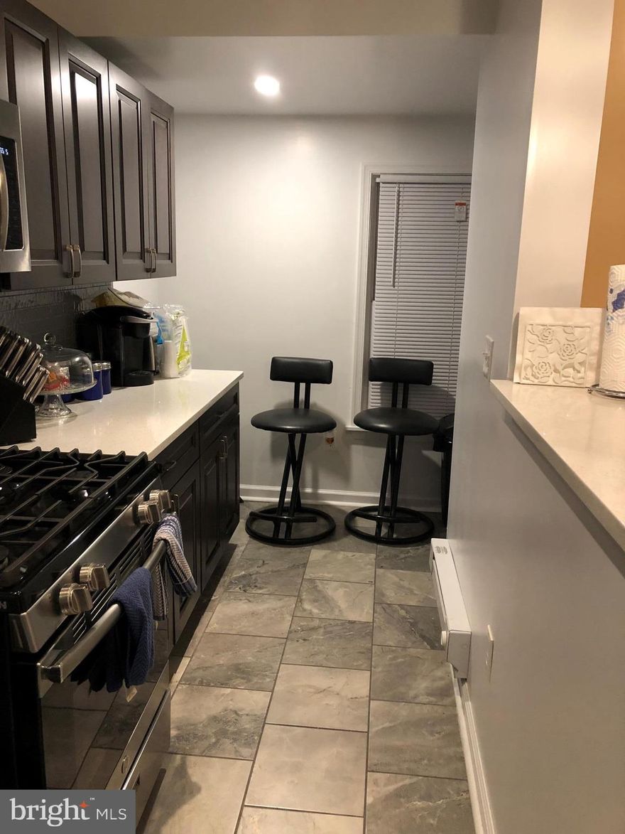 Welcome to 2532 S. 74th Street. in a townhome community, minutes away from 95 & the airport. This exquisite home features 3 bedrooms, 1 and half baths, celebrating easy living with style and grace. Entrance into a  seasonal enclosed front porch, Then you will be greeted by a spacious, brightly lit living room with hardwood floors. The inviting formal dining room is spacious also sporting hardwood floors. The Open, Ultra modern kitchen is the chef's delight with mahogany wood cabinets, breakfast bar, quartz counter  tops, stainless steel appliances, glass backsplash, recessed lighting & ceramic tile floors. The Kitchen leads to a mudroom which give access to a large rear deck. The second floor sports a master bedroom with closets galore, 2nd bedroom with ample closet space and good size third bedroom all with newer carpeting. Modern fully equipped center hall bathroom. The basement is part finished with a half bath, discreetly tucked in the basement is access to the builtin in garage. Put this on your tour today, you will not be disappointed. Exterior brick is currently in process. Make EMD payable to Buyer's Title company.