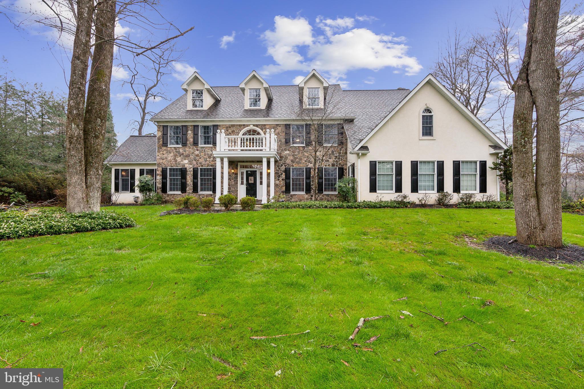 Welcome to this stunning stone and stucco 3-story colonial home built by Well-Bilt homes, an Amish company known for its quality construction. This beautiful home offers 4 bedrooms, home office, 3 full bathrooms, and 2 half bathrooms, along with a host of luxurious features that epitomize comfort and elegance. As you step inside you'll be greeted by the grandeur of crown moldings, recessed lighting and two staircases that add a touch of sophistication and function to the space. The home also boasts built-ins, two cozy fireplaces, whole house generator and a convenient second-floor laundry room next to an extra room which you can use as a second office, craft room or 5th bedroom. The heart of the home is the gourmet kitchen, a chef's dream with a 6-burner duel fuel Dacor appliance featuring two electric ovens, a warming drawer, mini-fridge, built-in microwave, refrigerator, quartz countertops, beautiful white cabinets, and a charming breakfast area. The luxurious master suite is a sanctuary with two spacious walk-in closets and a master bathroom that exudes opulence, complete with quartz countertops, rich dark wood cabinets, and a soaking tub nestled next to a captivating stone wall. The large finished basement includes a workout room with rubber flooring, a half bath and a large storage area. There is also a walk up partially finished attic that could be a large future game room. Step outside to your own private paradise, featuring an outdoor wood-burning firepit and seating area, as well as a covered patio with a gas fireplace and TV/speakers—perfect for entertaining or relaxing in style. Enjoy ample outdoor space with a large private yard and a spacious driveway. This home also offers easy access to downtown Media, known for its vibrant dining, bars, and shopping scene, as well as the nearby amenities in Newtown Square, including a Wholefoods, state liquor store, Ulta, and charming non-chain stores. Don't miss out on the opportunity to make this exceptional property your new home, where luxury, comfort, and convenience converge seamlessly.