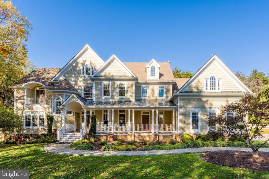 Join us Saturday, 11/1 + Sunday, 11/2 from 1-3PM for an Open House! Impressive Great Falls refuge with carriage home, pool, and over 7,000 square feet of living space you won’t want to miss. This stunning craftsman-style residence features cedar siding, dramatic gables and eaves, and a welcoming front porch that creates exceptional curb appeal. A separate carriage home serves as both a 3-car garage and a fully equipped guest residence, complete with a kitchen area, full bath, and sleeping space for 4+ - perfect for guests, in-laws, or extended stays. The main home also includes an attached 3-car garage, offering a total of six covered spaces.

Inside, the main level welcomes you with a spacious foyer and powder room. A main-level primary suite (or optional office) includes built-ins and an en-suite handicapped bath with a roll-in shower, while a formal living room with French doors adds elegance and flexibility. The inviting family room centers around a cozy stone fireplace and opens to a spacious kitchen. The formal dining room, complete with wine storage for over 2,000 bottles, butler’s pantry, and gas fireplace, comfortably seats up to 13. The adjoining sunroom, lined with windows, fills the home with natural light and provides overflow dinner seating for 10 as well as an ideal spot for summer dinners.

Upstairs, four generous bedrooms each feature en-suite baths and closets with custom cabinetry, including a luxurious primary suite with its own office and spa-like bath. Convenient laundry is also located on the bedroom level. One floor up, a finished attic offers an office, a full bath and five custom  Murphy beds cleverly arranged - perfect for a playroom, guest suite, or epic sleepovers.

The finished walk-up lower level has a sleek, modern design and includes a full bed with en-suite bath, a kitchenette and dining area, a recreation room with pool table, and a theater room. An additional full bath with a built-in sauna provides the ultimate relaxation retreat, and three additional Murphy beds.  In total, the house has bed sleeping for 27, providing great flexibility to accommodate family gatherings.

The family room, living room, primary suite, and carriage home each feature exceptional home theaters –complemented by the dedicated theater on the lower level. Both structures are equipped with backup generators, and the main house includes instant battery backup for critical lighting  – an ideal feature for elderly or mobility-impaired occupants. Internet service is available through Verizon FiOS, Cox, and Starlink. The property also includes two leased 1,000-gallon propane tanks from AmeriGas and a private well for water.

Outdoor living is equally impressive with a heated in-ground pool, hot tub, built-in fire pit, and Trex deck featuring a Kalamazoo grilll, Kalamazoo pizza oven and a Viking gas wok - perfect for entertaining year-round. Ideally located just off Seneca Road, this home offers easy access to shopping, dining, major commuter routes, and is part of the highly sought-after Langley High School pyramid.